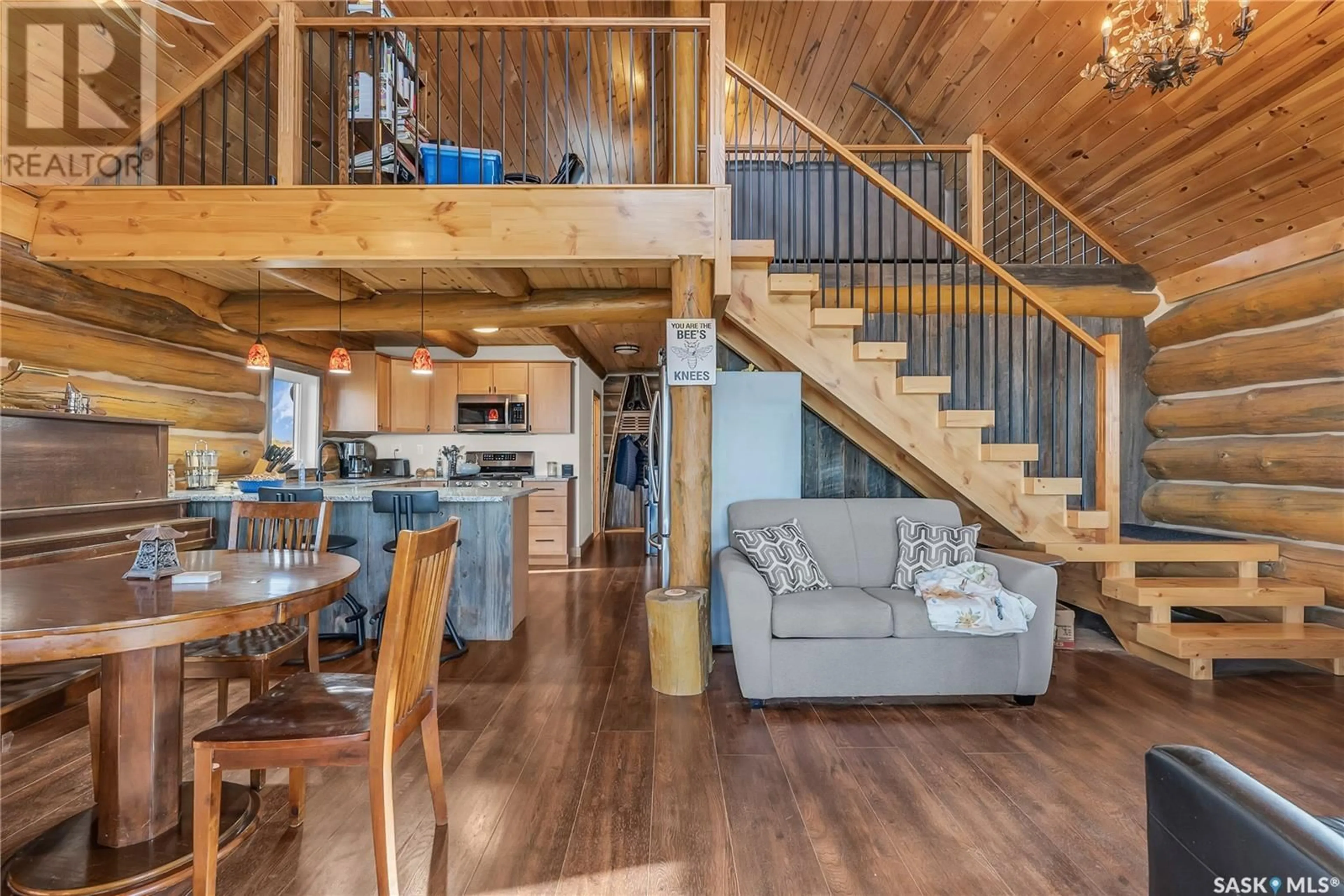Open concept kitchen, wood/laminate floor for BLUE HERON GARDENS, Fish Creek Rm No. 402 Saskatchewan S0K1B0