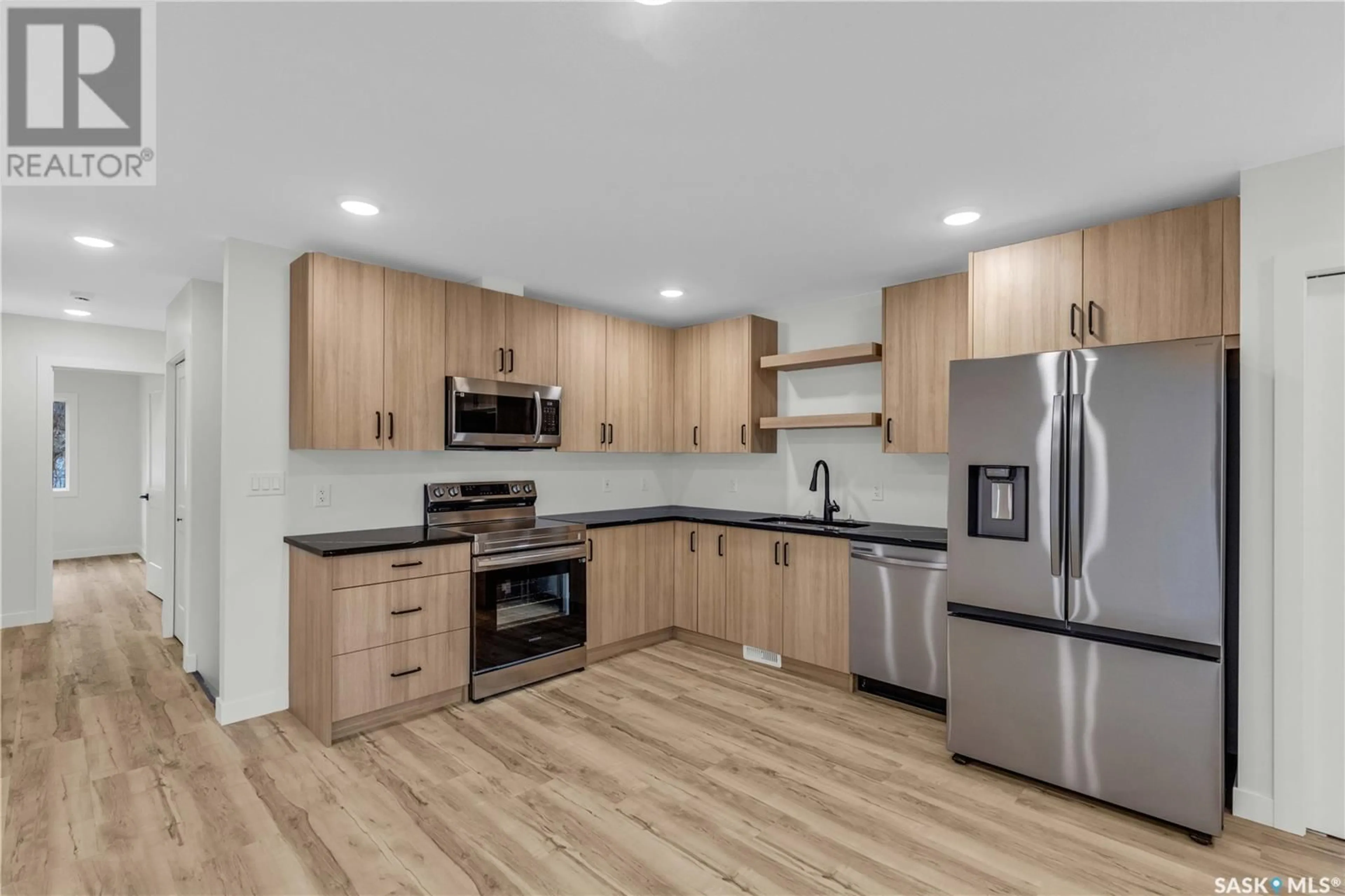 Open concept kitchen, wood/laminate floor for 1232 E AVENUE N, Saskatoon Saskatchewan S7K2E4