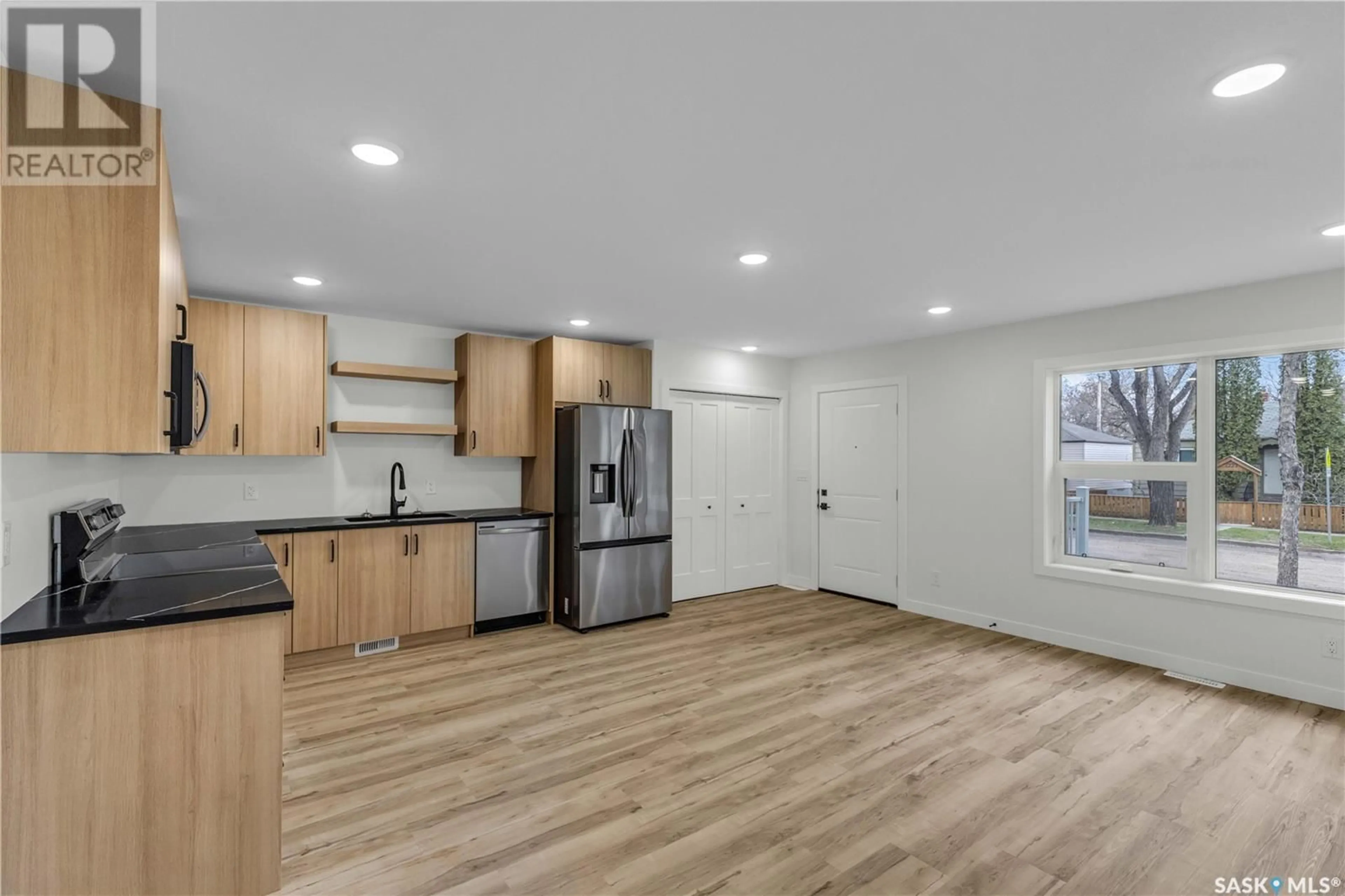 Open concept kitchen, wood/laminate floor for 1232 E AVENUE N, Saskatoon Saskatchewan S7K2E4
