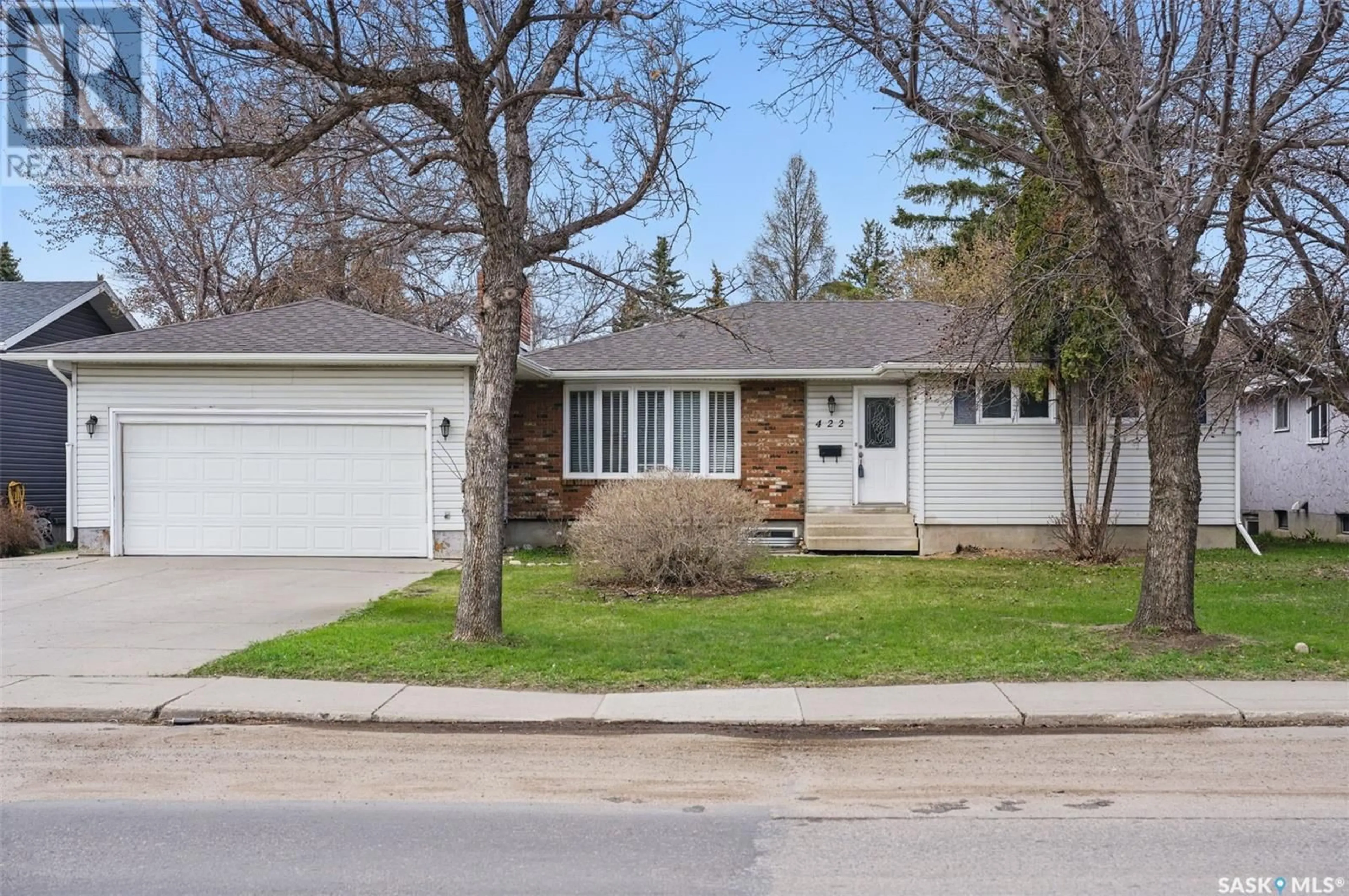 Home with vinyl exterior material, street for 422 115TH STREET, Saskatoon Saskatchewan S7N2E6