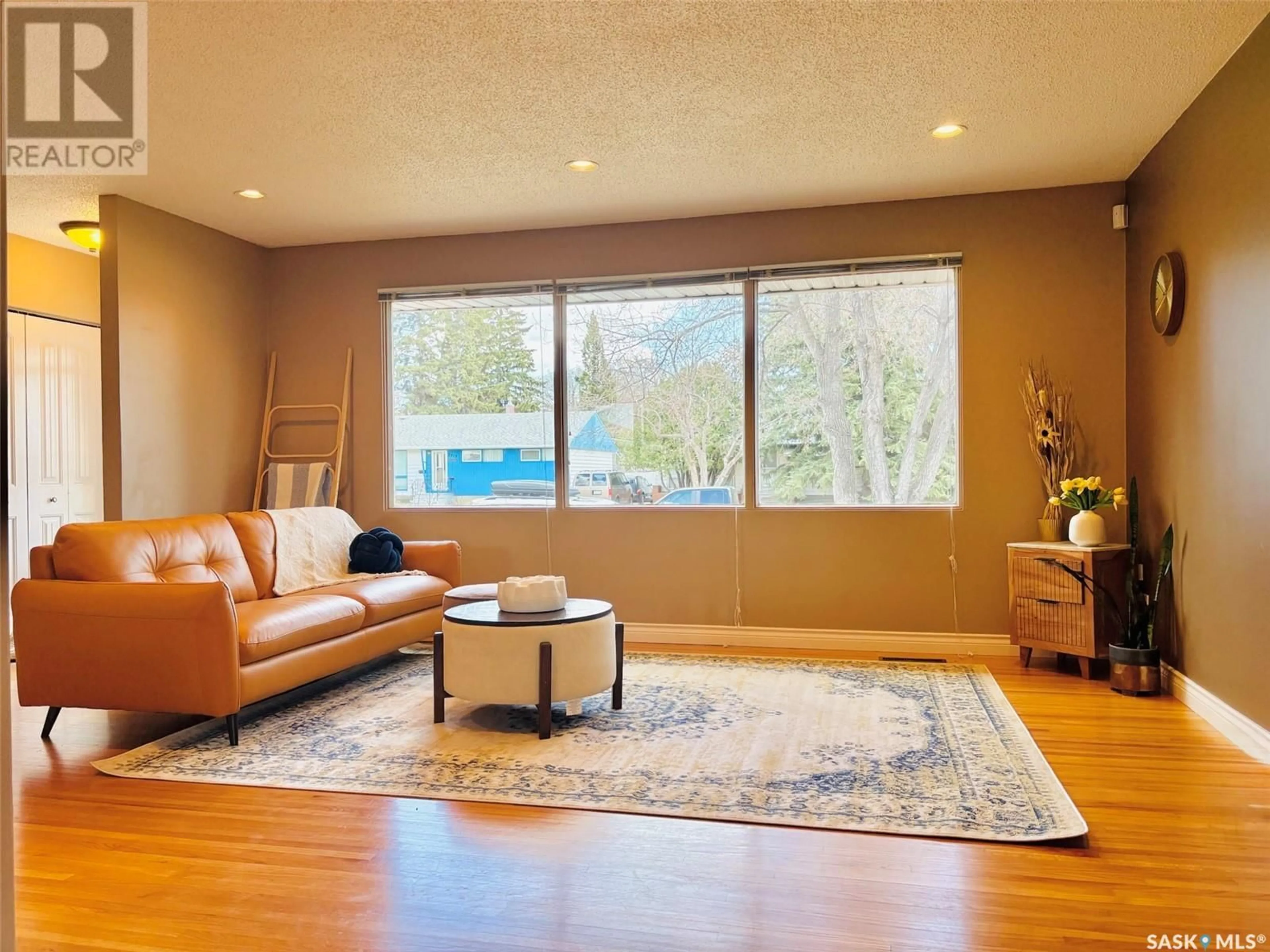 Living room with furniture, wood/laminate floor for 2318 CAIRNS AVENUE, Saskatoon Saskatchewan S7J1V1