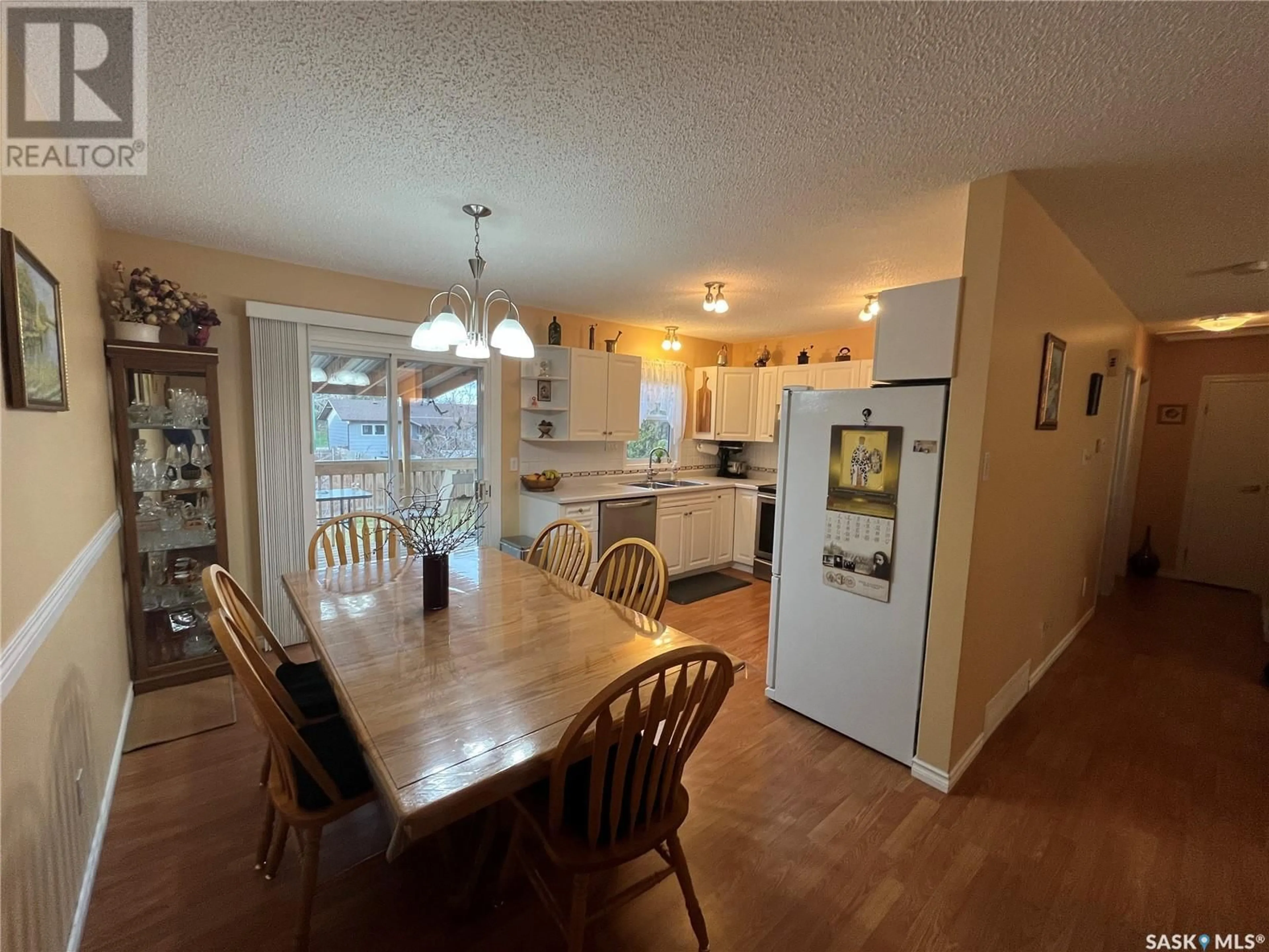 Open concept kitchen, wood/laminate floor for 62 GALBRAITH CRESCENT, Saskatoon Saskatchewan S7M4H1