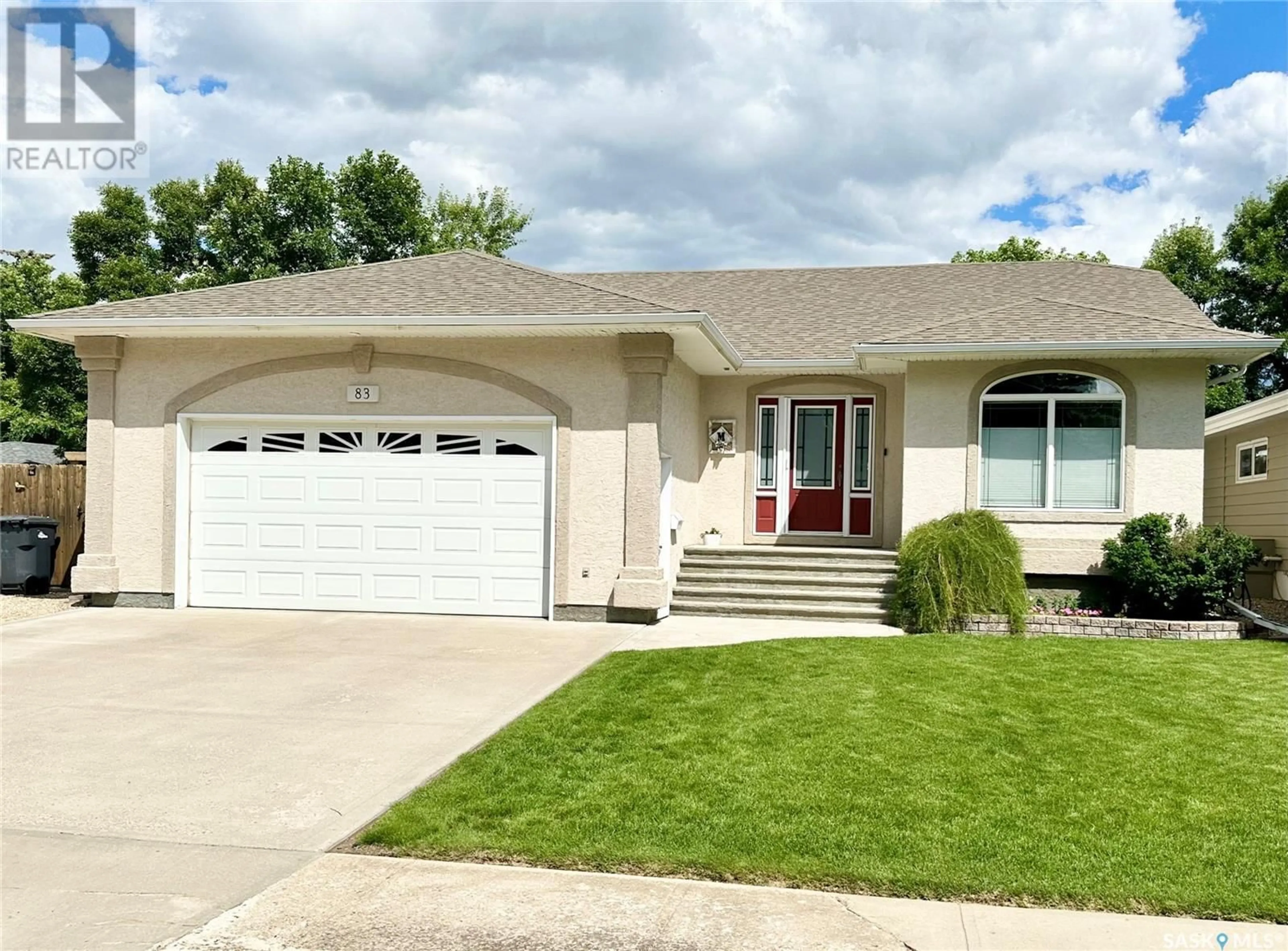 Home with vinyl exterior material, street for 83 ASH DRIVE, Weyburn Saskatchewan S4H0R9