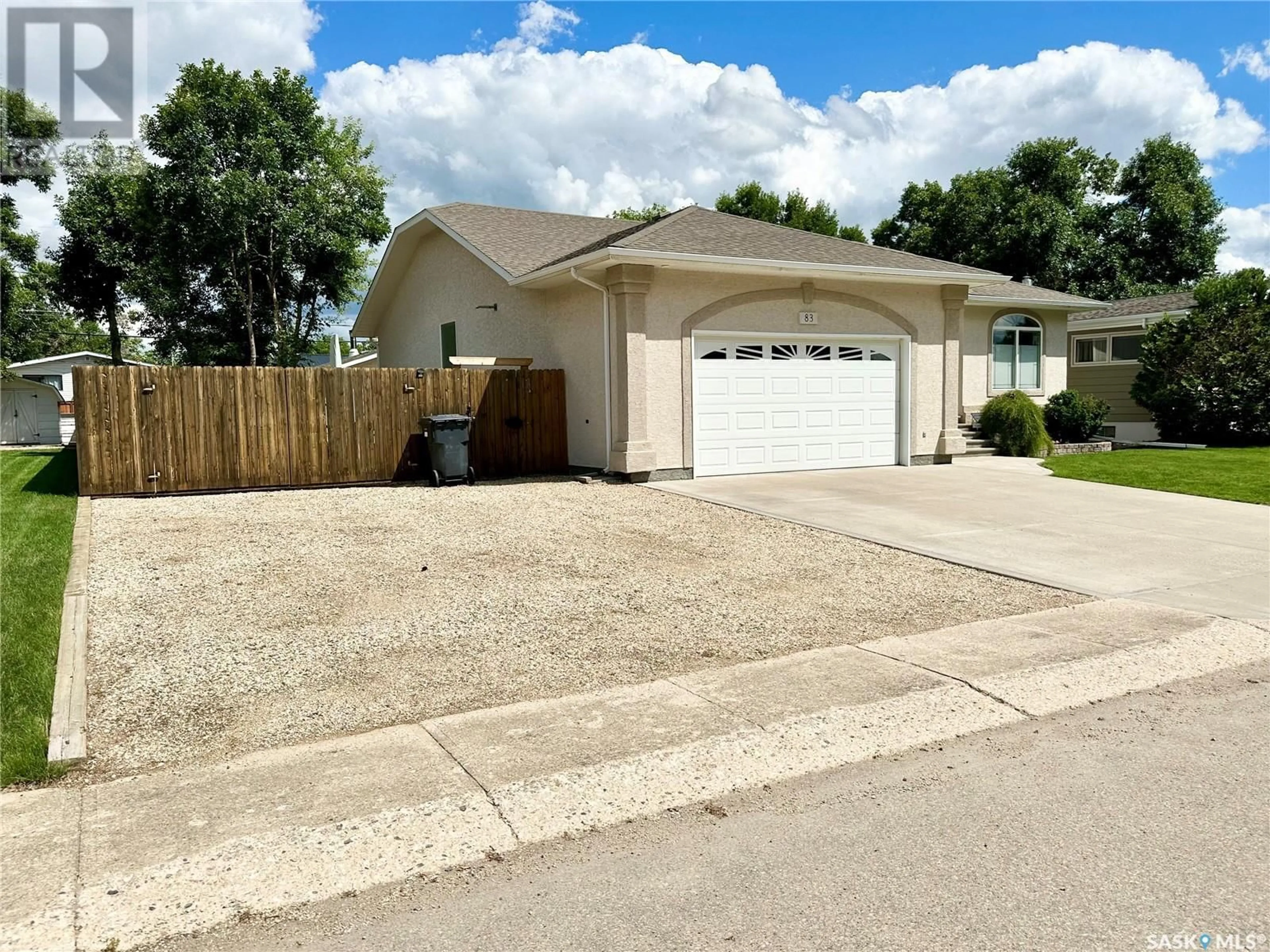 Home with vinyl exterior material, street for 83 ASH DRIVE, Weyburn Saskatchewan S4H0R9