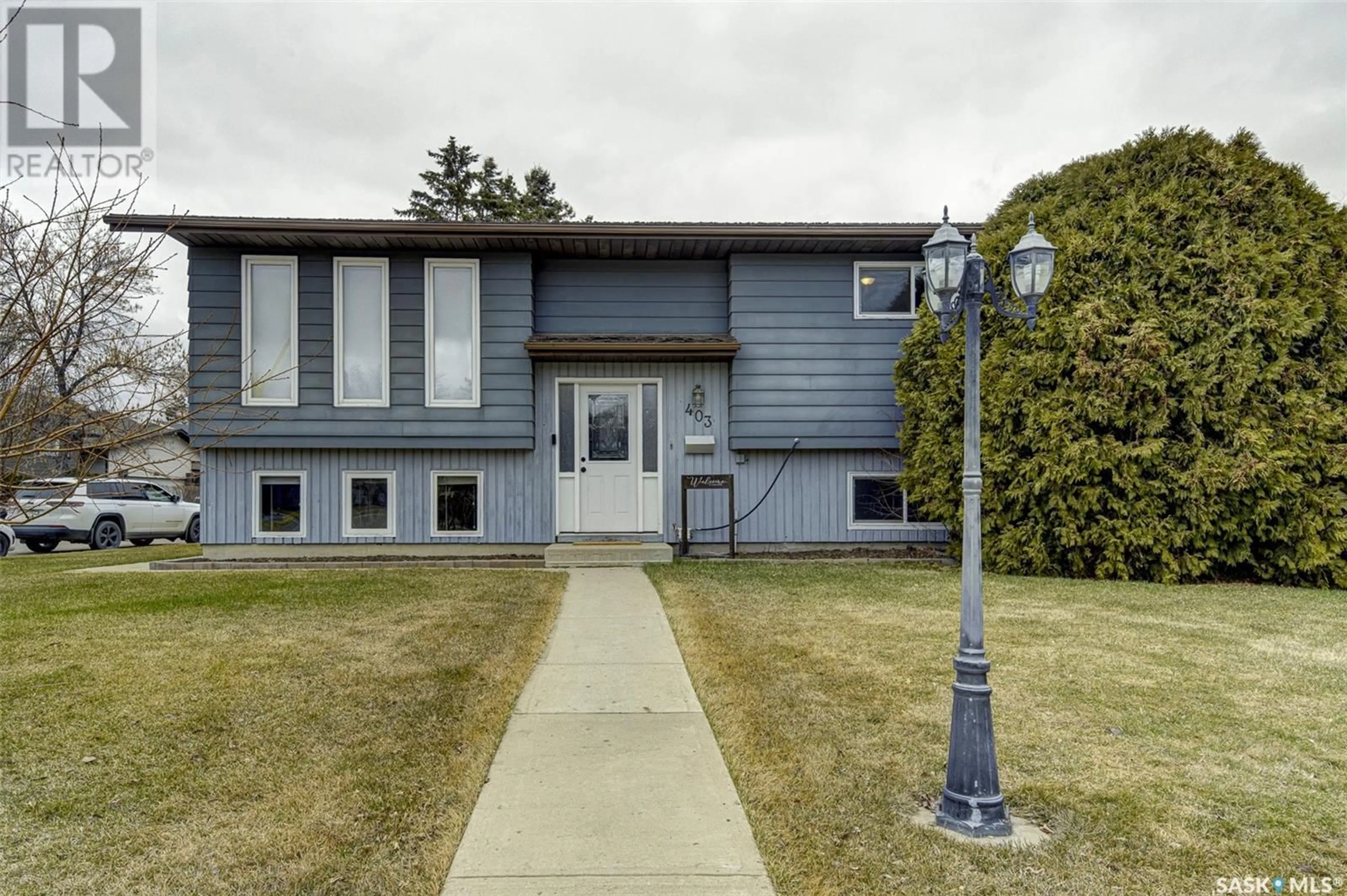 Home with vinyl exterior material, street for 403 CHARLEBOIS WAY, Saskatoon Saskatchewan S7K5J8