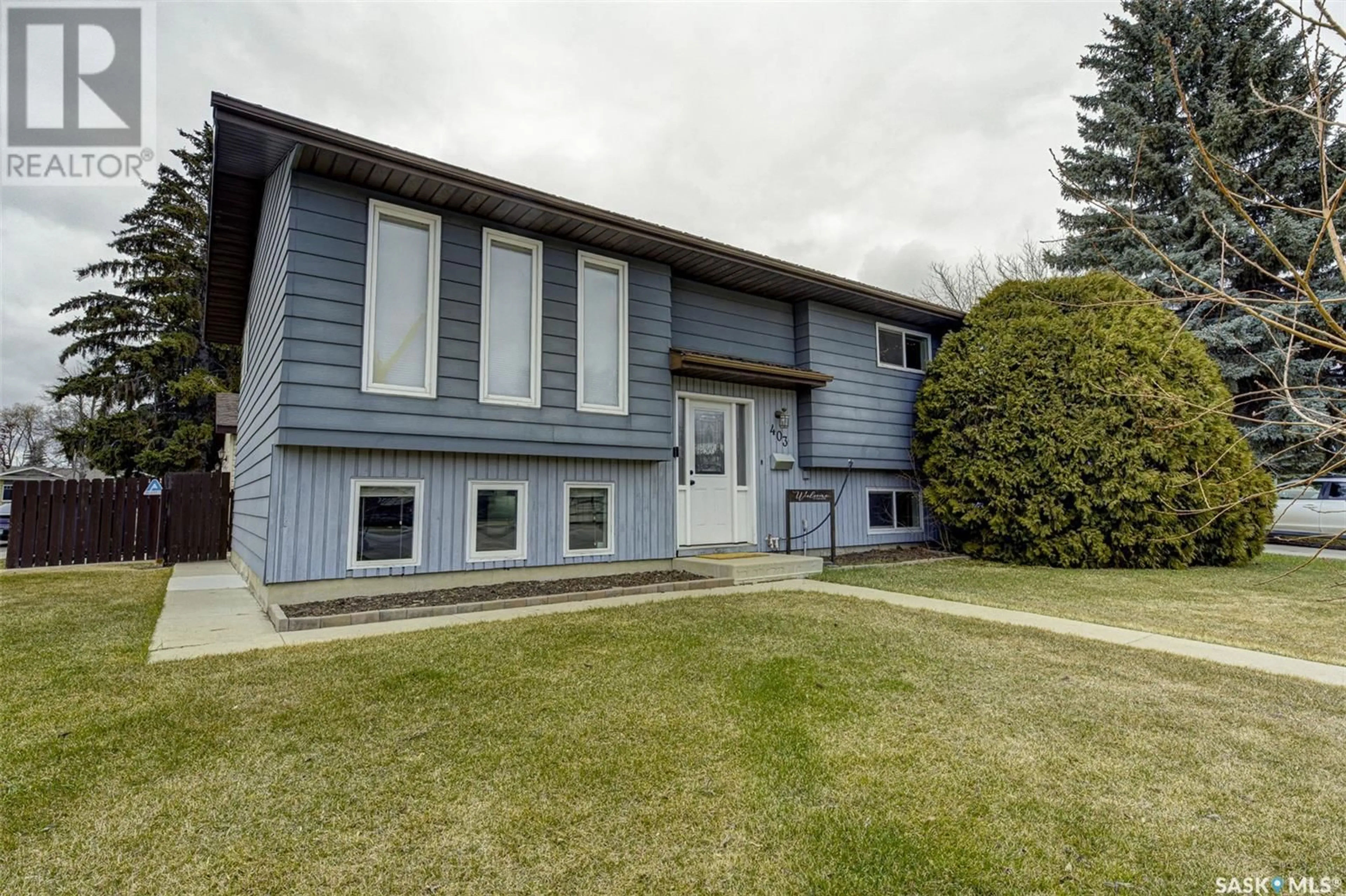 Home with vinyl exterior material, street for 403 CHARLEBOIS WAY, Saskatoon Saskatchewan S7K5J8