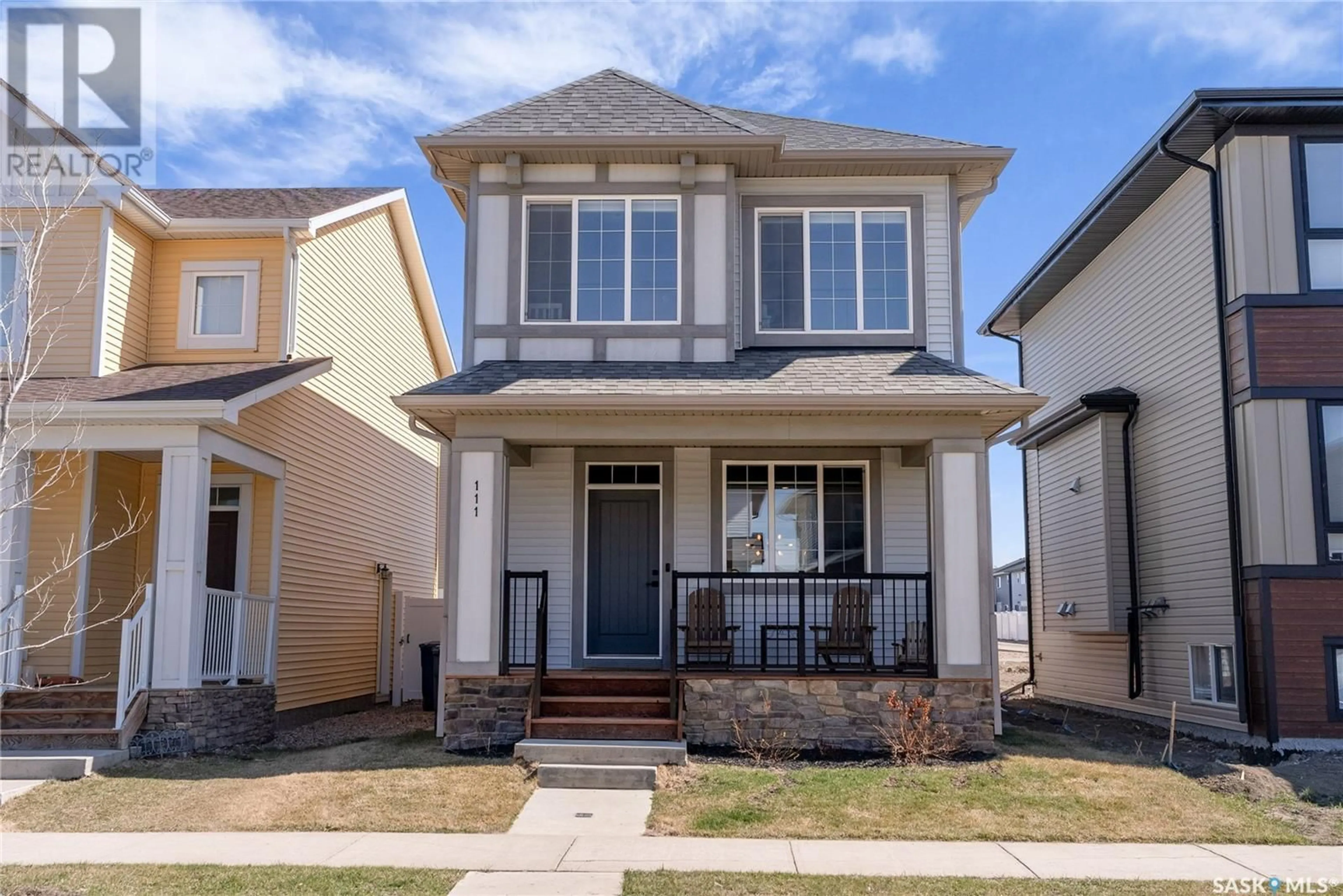 Home with vinyl exterior material, street for 111 TAUBE AVENUE, Saskatoon Saskatchewan S7V0W1