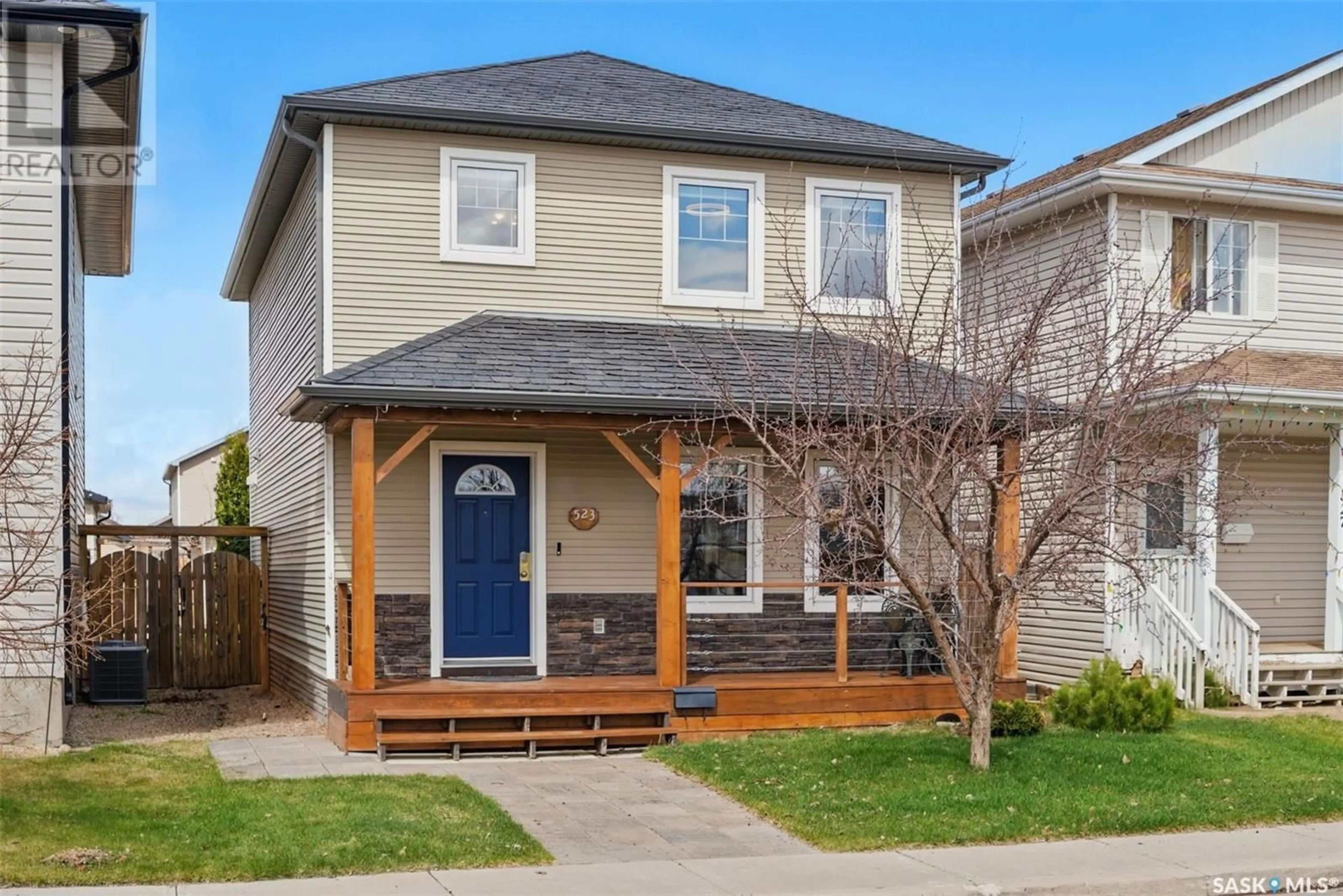 Home with vinyl exterior material, street for 523 MAGUIRE LANE, Saskatoon Saskatchewan S7W1A2