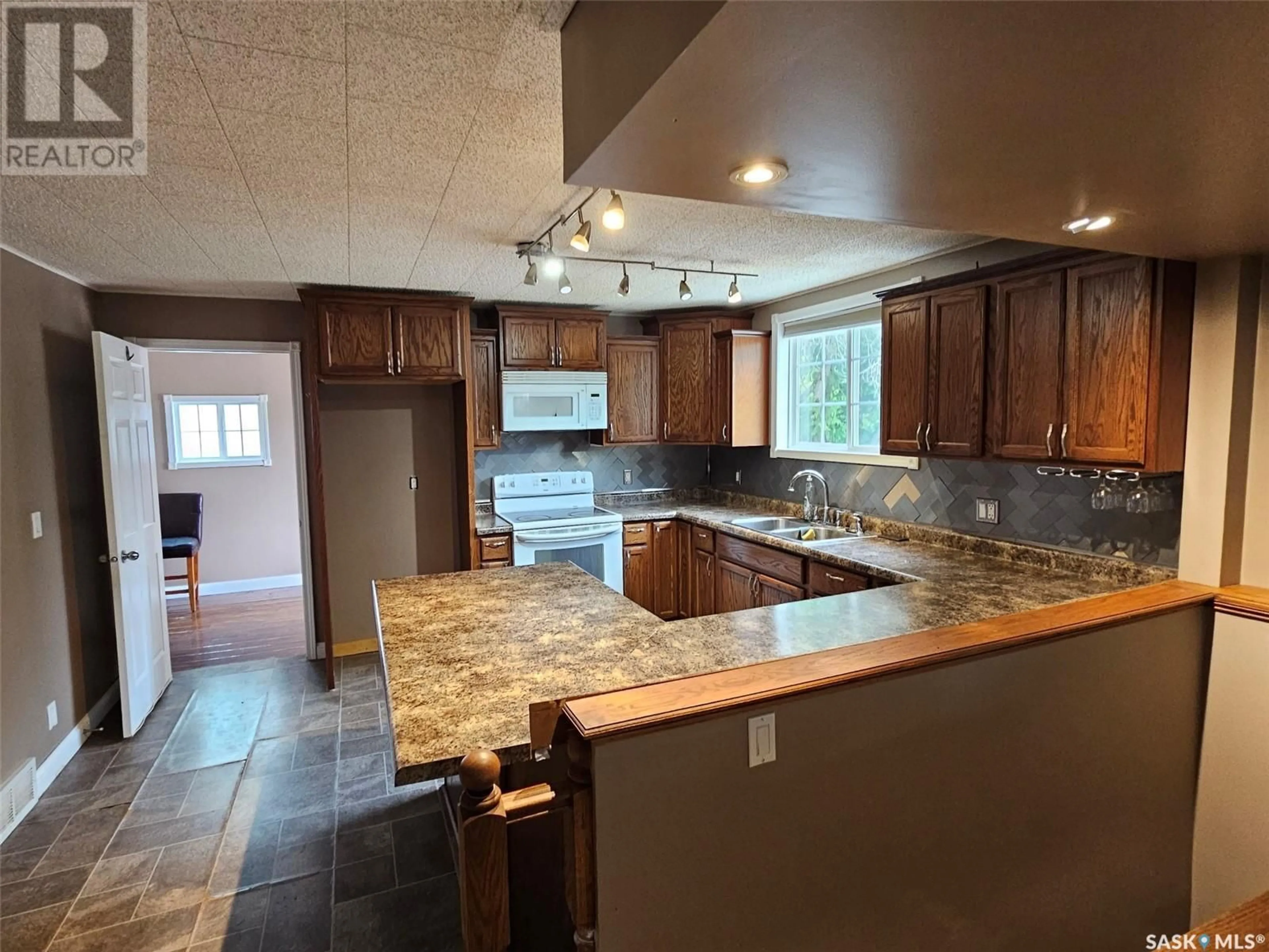 Open concept kitchen, ceramic/tile floor for 308 4TH STREET, Carlyle Saskatchewan S0C0R0