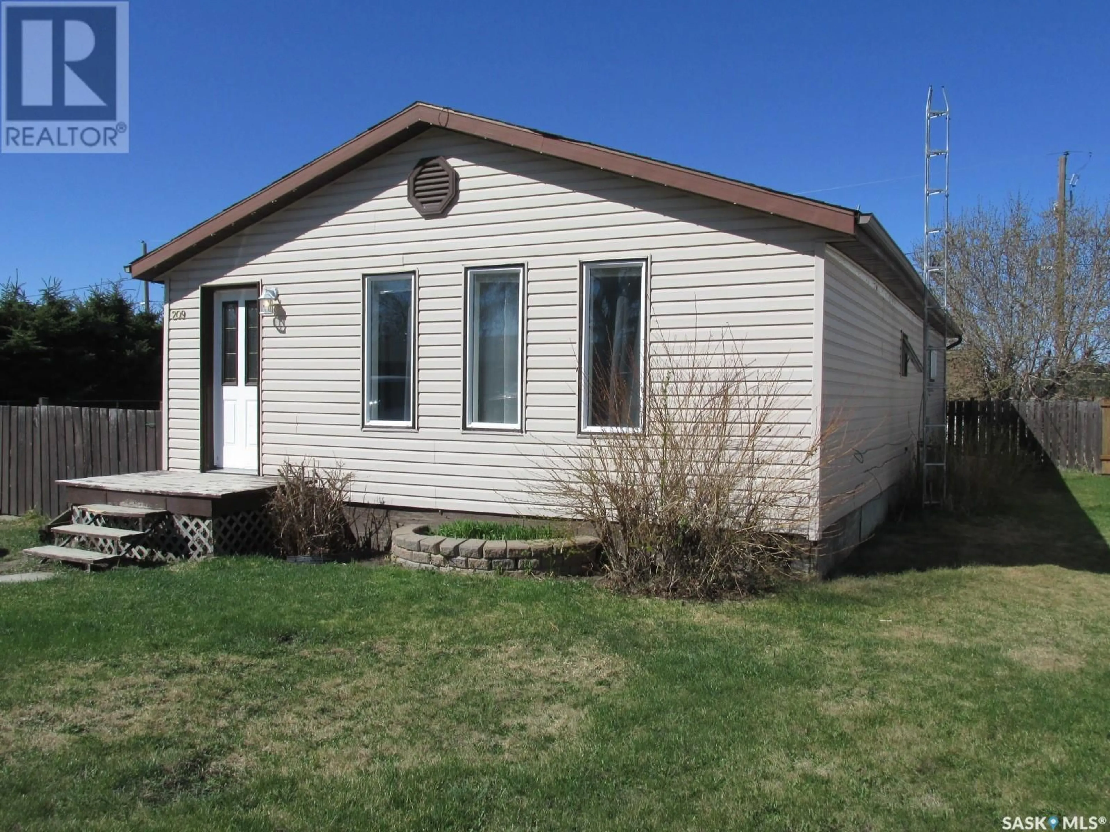 Home with vinyl exterior material, street for 209 RUSTAD AVENUE, White Fox Saskatchewan S0J3B0