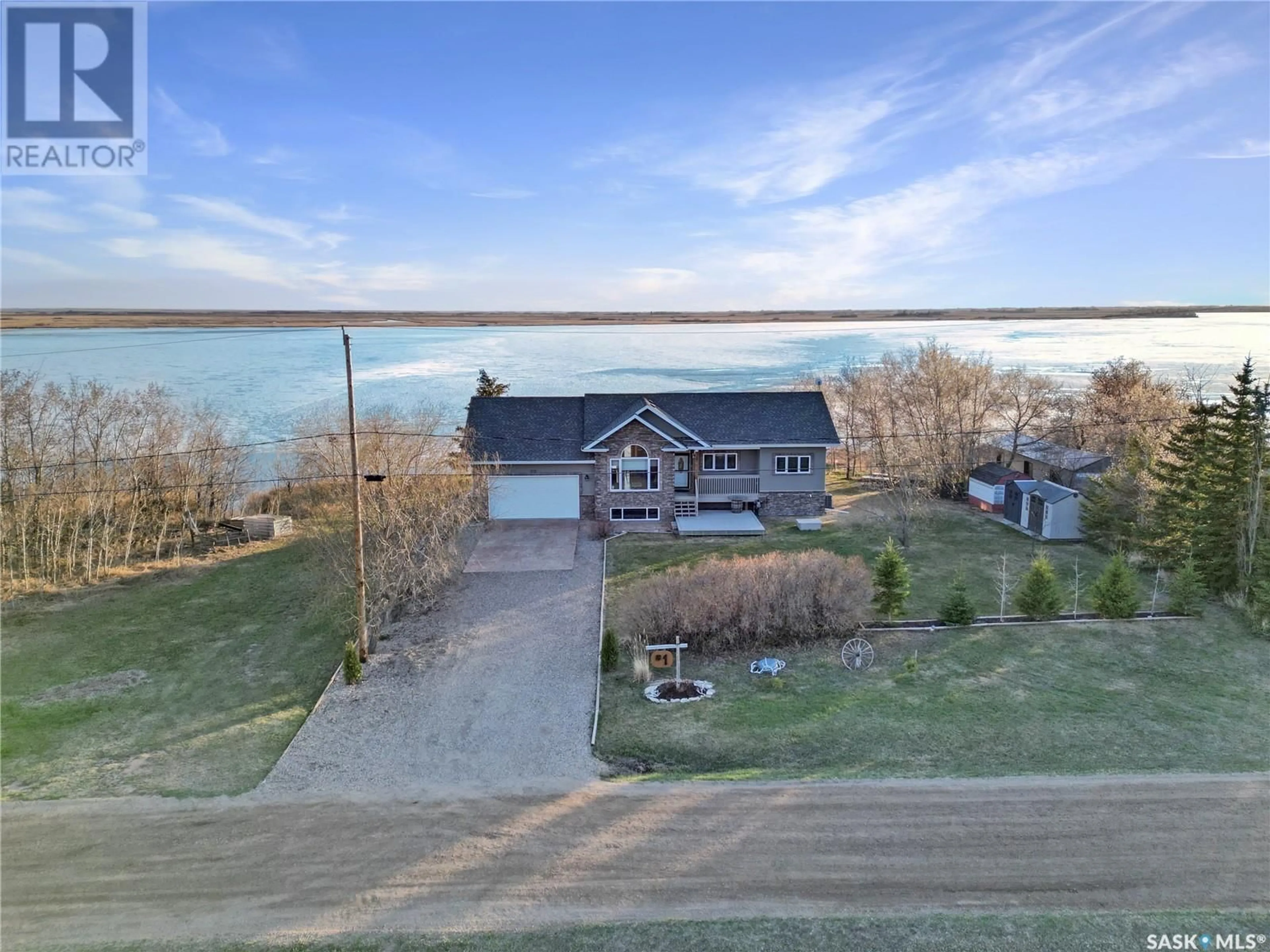 A pic from outside/outdoor area/front of a property/back of a property/a pic from drone, water/lake/river/ocean view for 1 SUMMERFIELD DRIVE, Jackfish Lake Saskatchewan S0M0L0