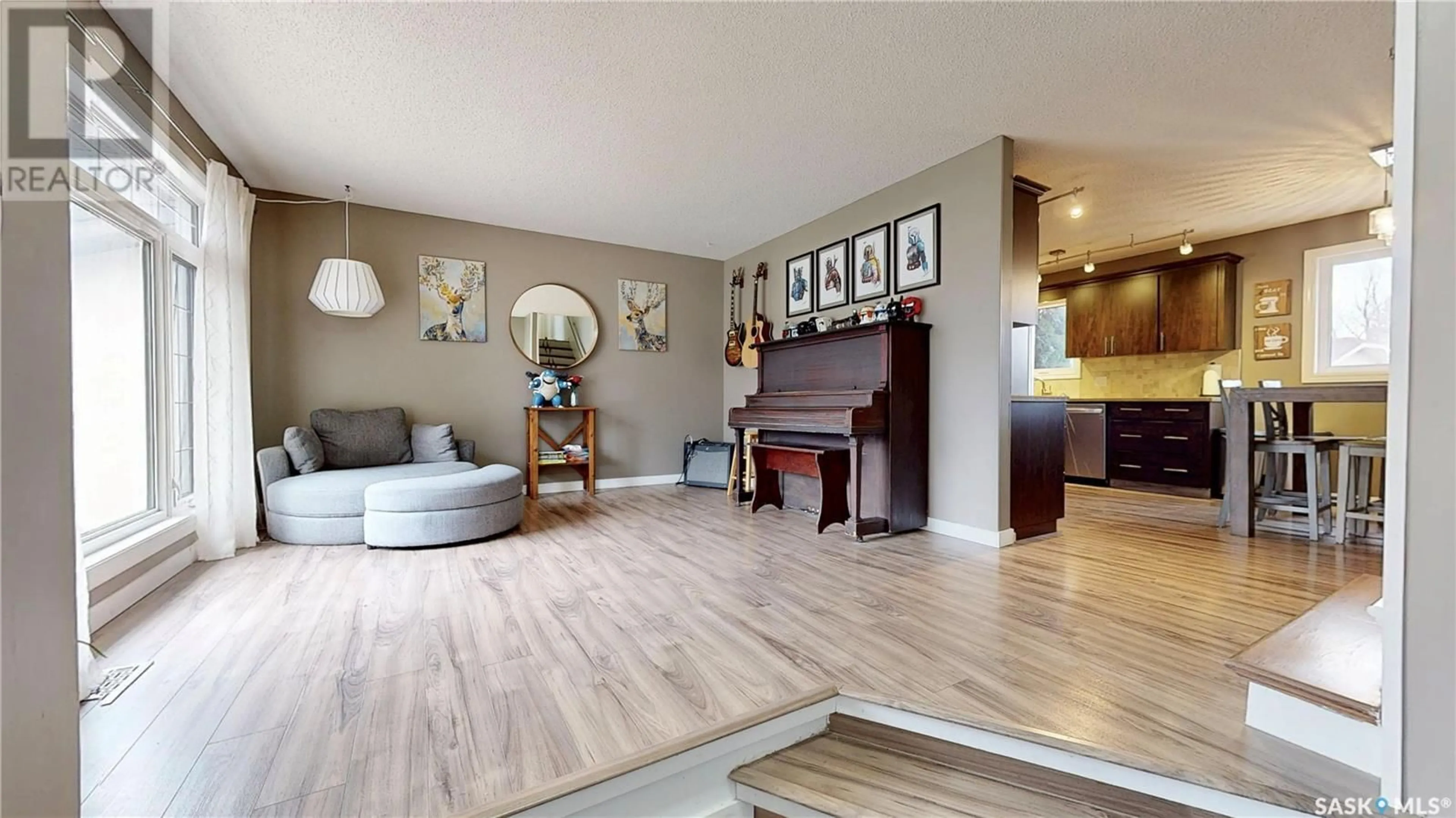 Living room with furniture, wood/laminate floor for 3210 ARENS ROAD, Regina Saskatchewan S4V1J8
