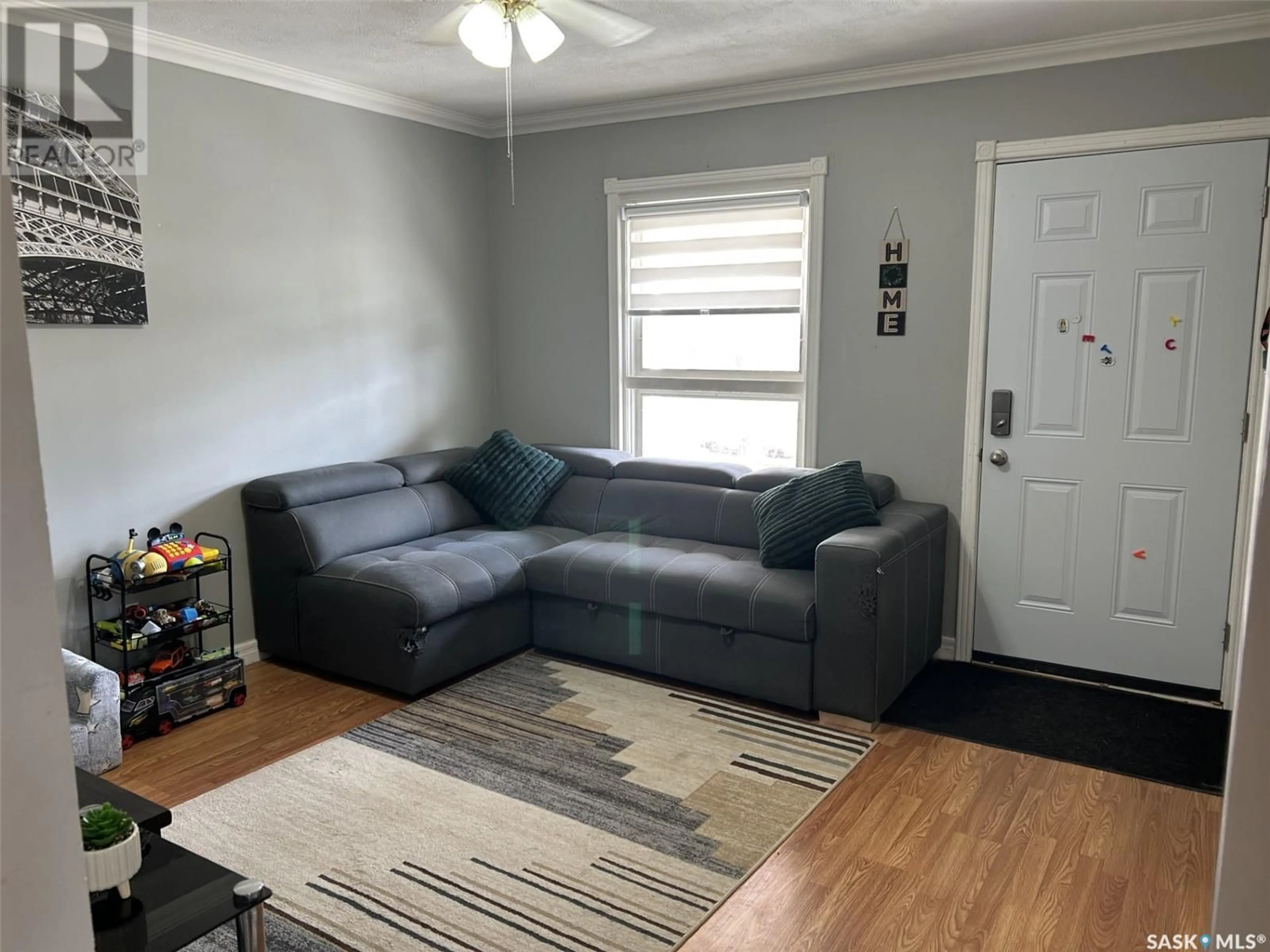 Living room with furniture, unknown for 718 ATHABASCA STREET E, Moose Jaw Saskatchewan S6H0M5