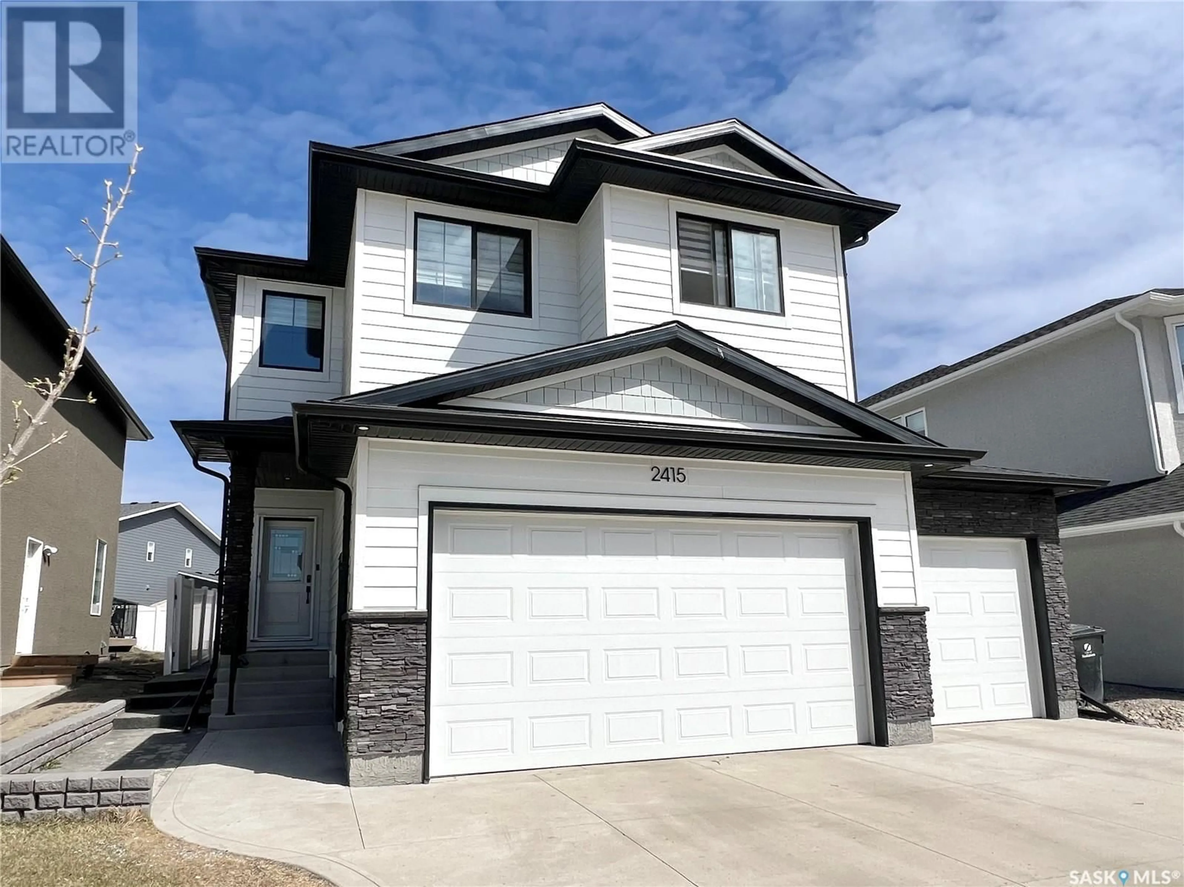 Home with vinyl exterior material, street for 2415 ROSEWOOD DRIVE, Saskatoon Saskatchewan S7V0Z3