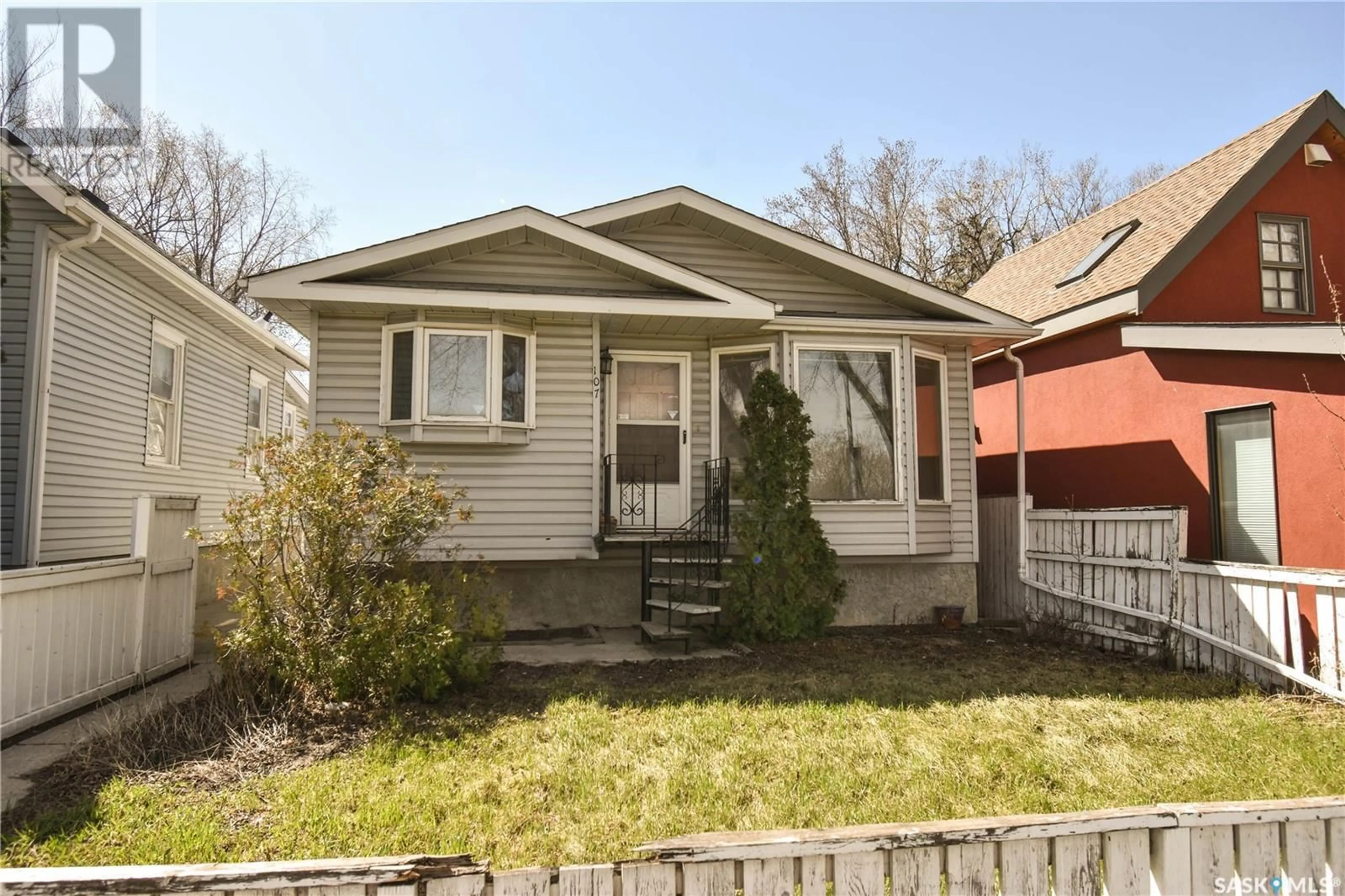 Home with vinyl exterior material, street for 107 8TH STREET, Saskatoon Saskatchewan S7M0B6