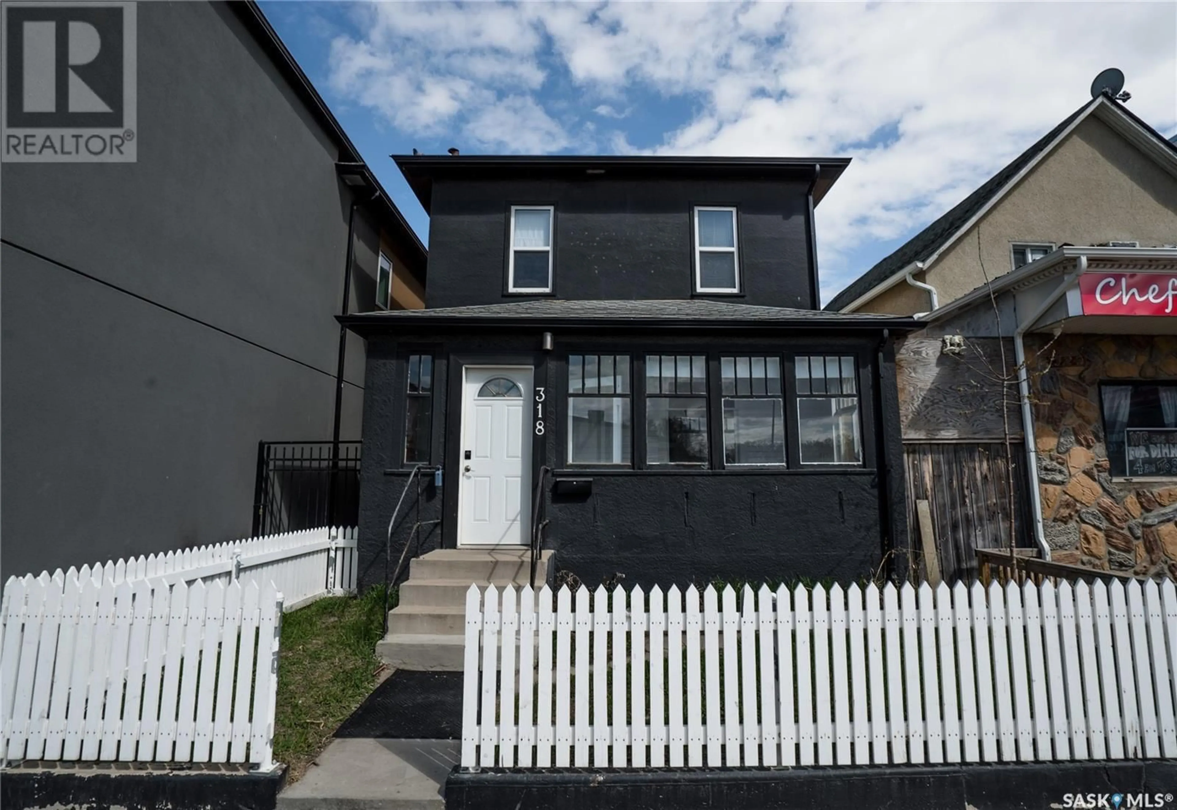 Home with vinyl exterior material, street for 318 C AVENUE, Saskatoon Saskatchewan S7M1N4