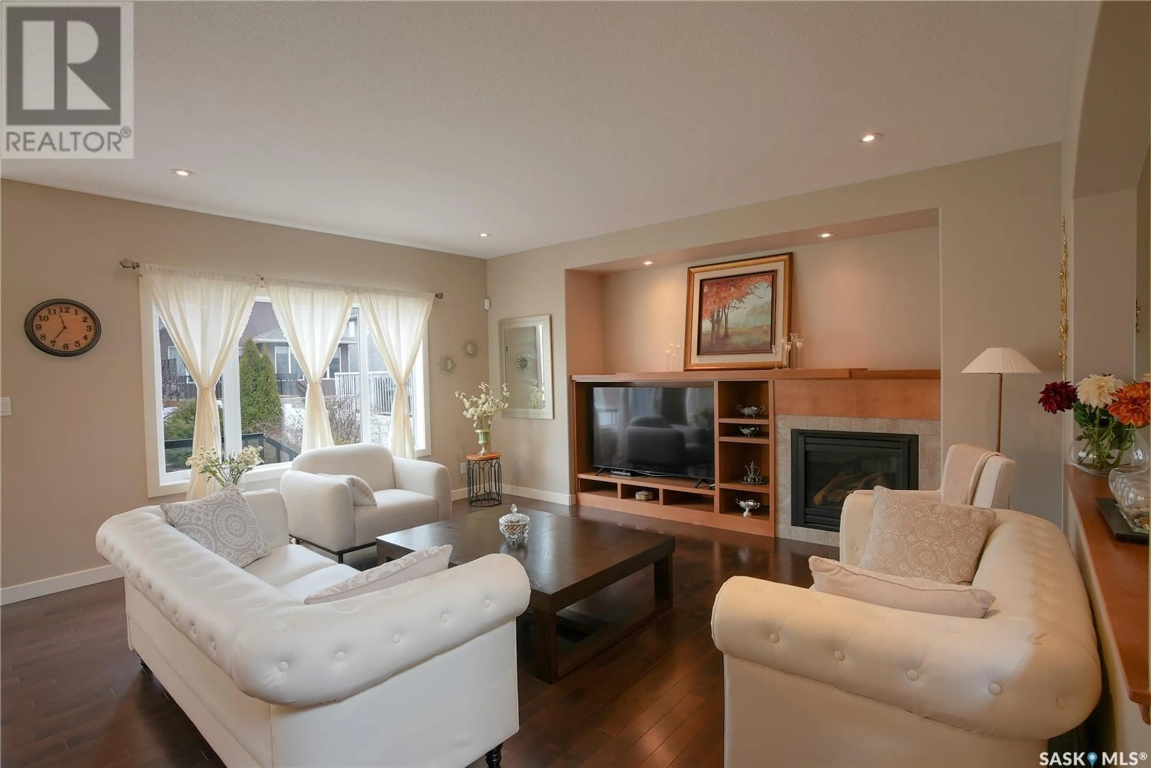 Living room with furniture, wood/laminate floor for 4629 MALCOLM DRIVE, Regina Saskatchewan S4W0B5