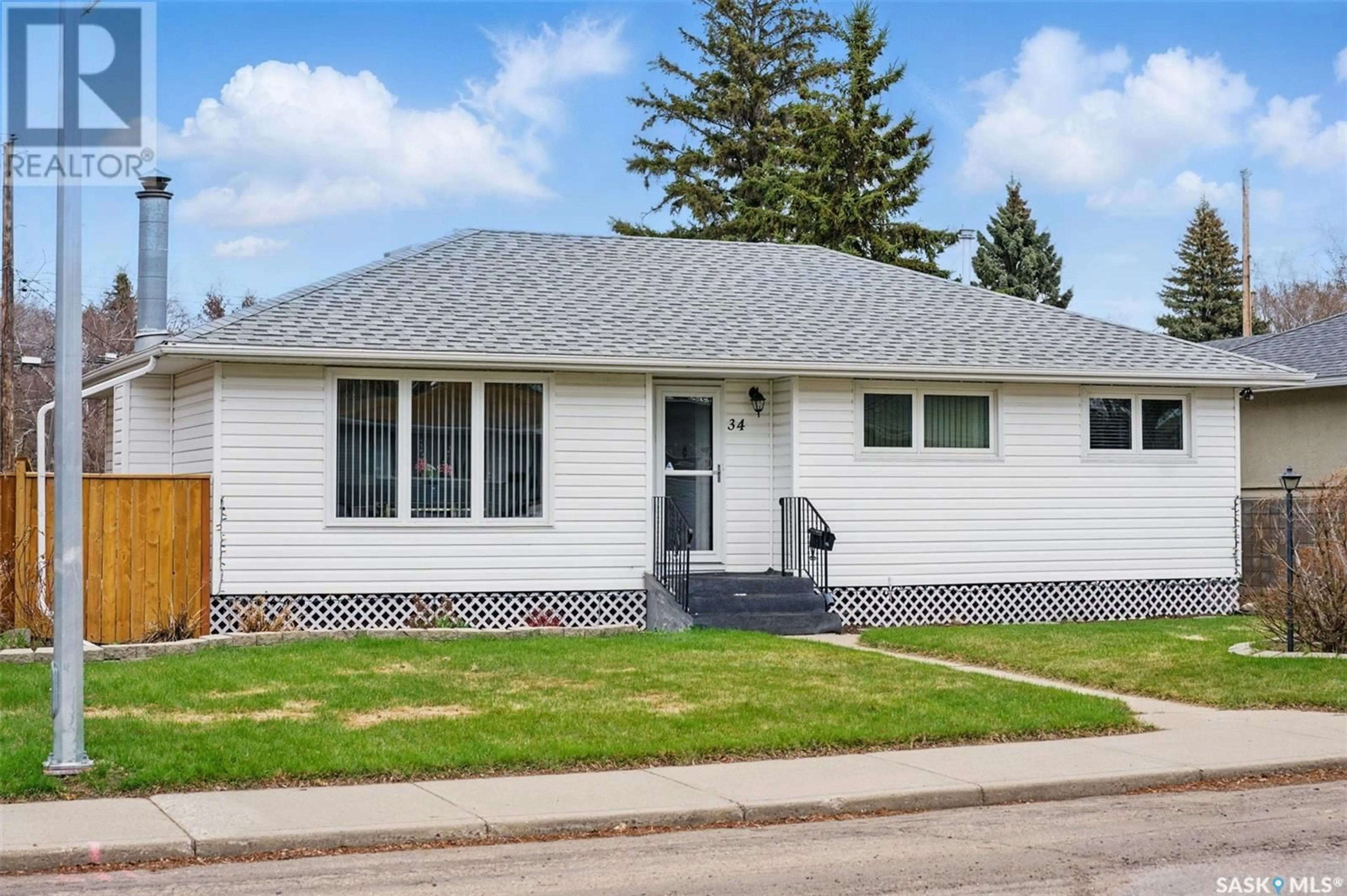 Home with vinyl exterior material, street for 34 BELL CRESCENT, Saskatoon Saskatchewan S7J2W3