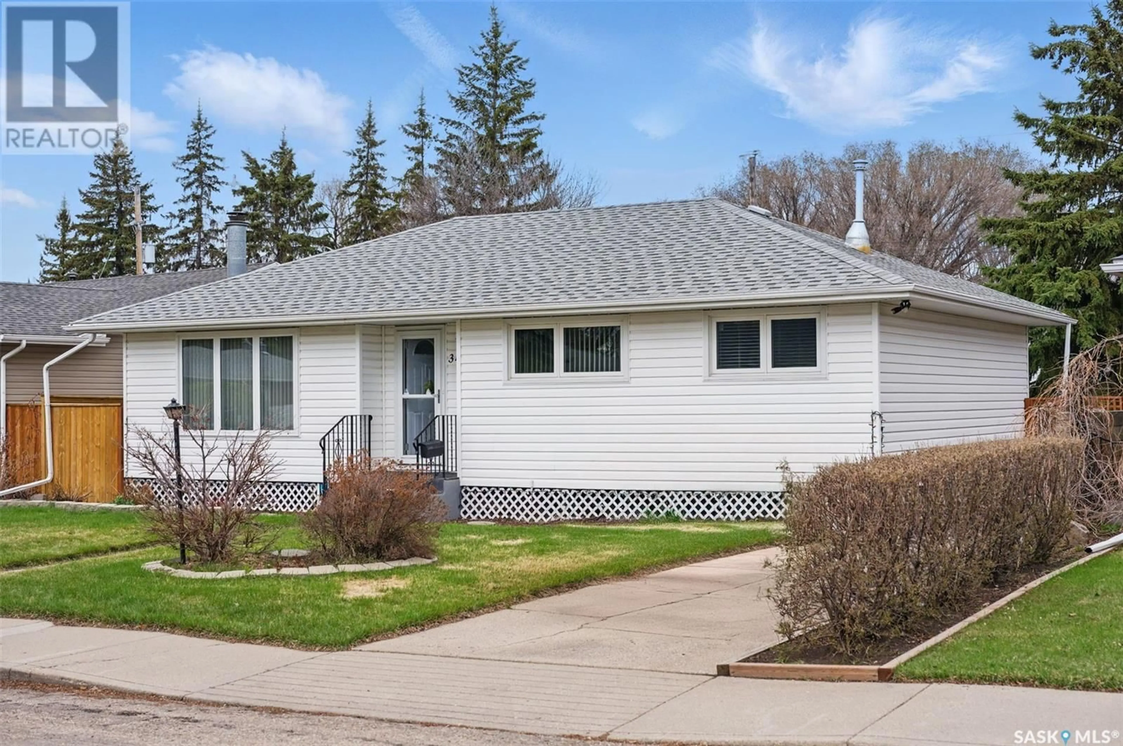 Home with vinyl exterior material, street for 34 BELL CRESCENT, Saskatoon Saskatchewan S7J2W3