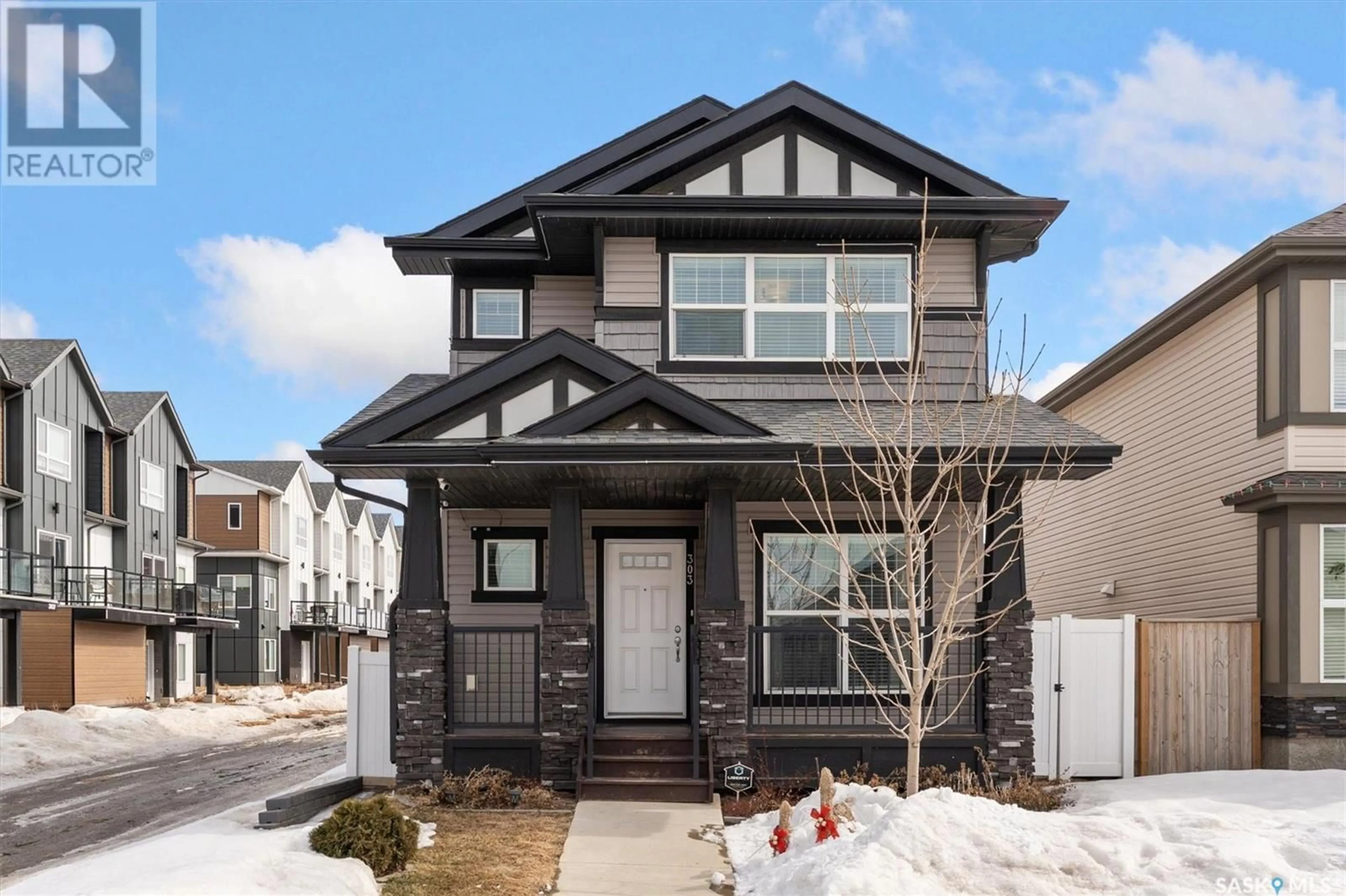 Home with brick exterior material, street for 303 DELAINEY MANOR, Saskatoon Saskatchewan S7V0N4