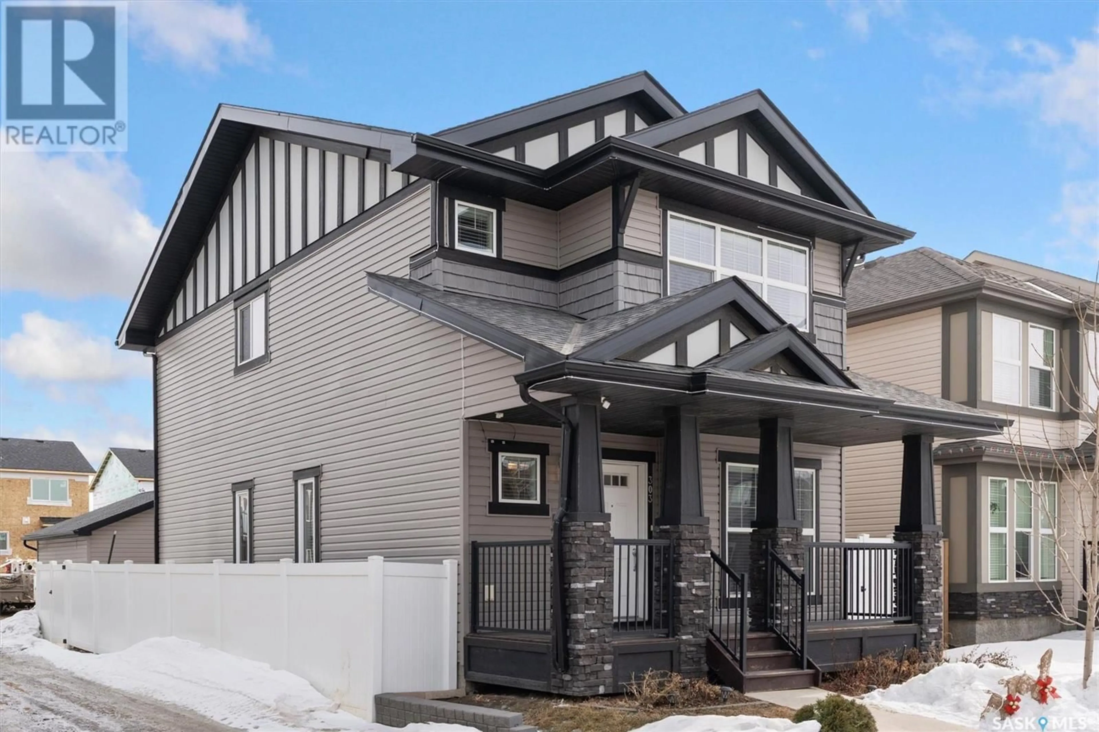 Home with vinyl exterior material, street for 303 DELAINEY MANOR, Saskatoon Saskatchewan S7V0N4