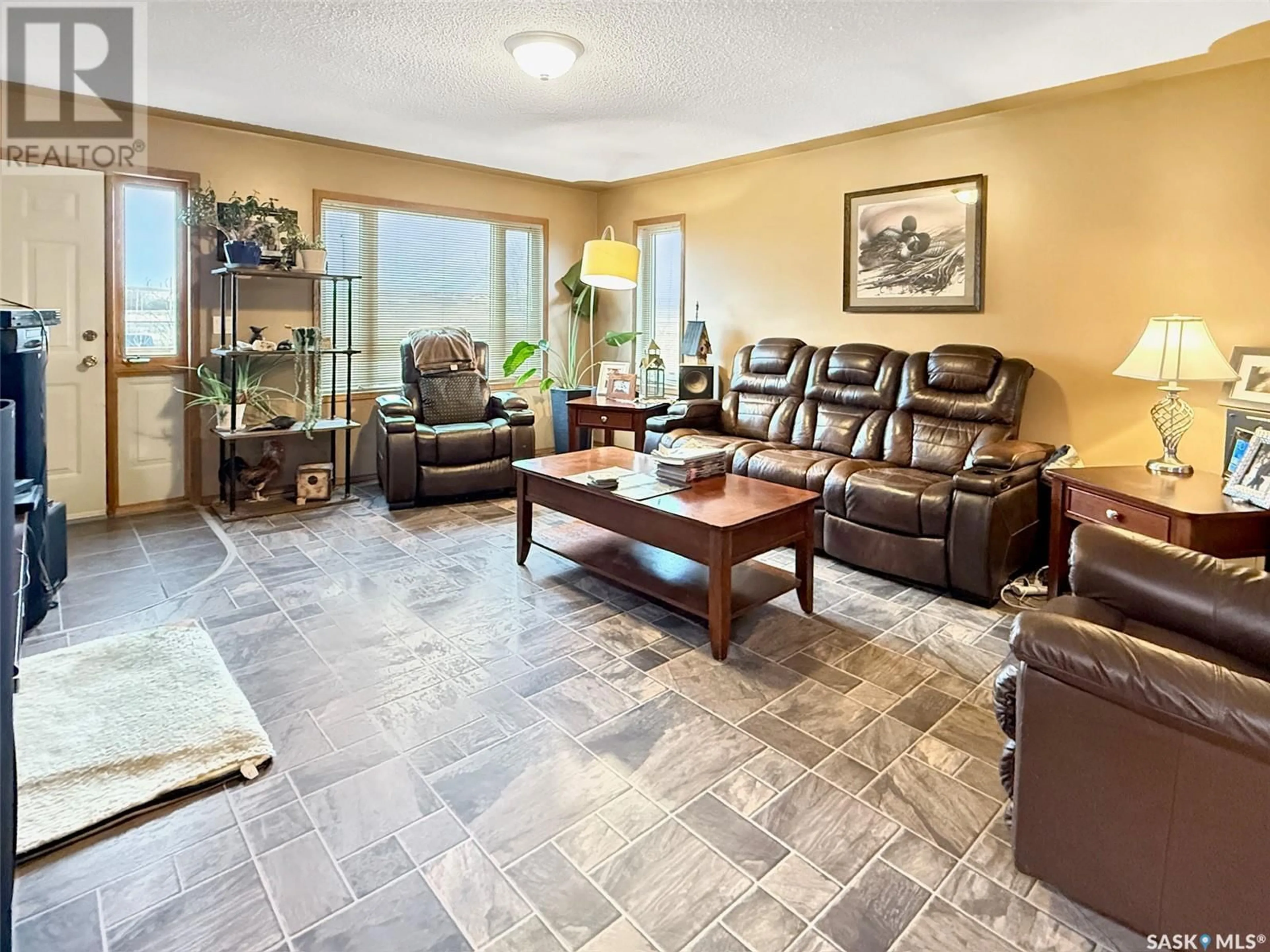 Living room with furniture, ceramic/tile floor for 216 PACIFIC AVENUE, Beverley Saskatchewan S9H4V1