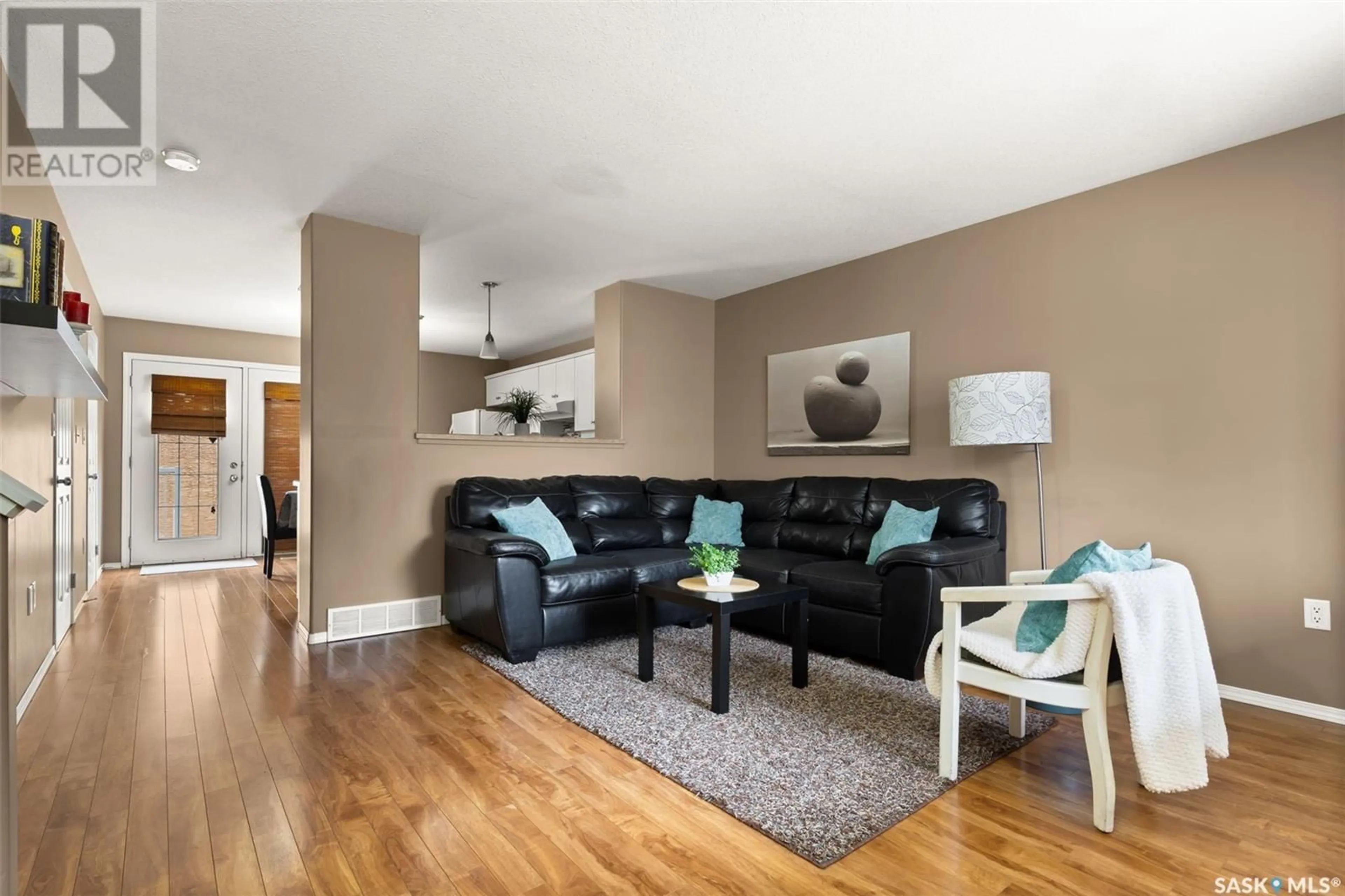 Living room with furniture, wood/laminate floor for 1204 14TH AVENUE, Regina Saskatchewan S4P0B8