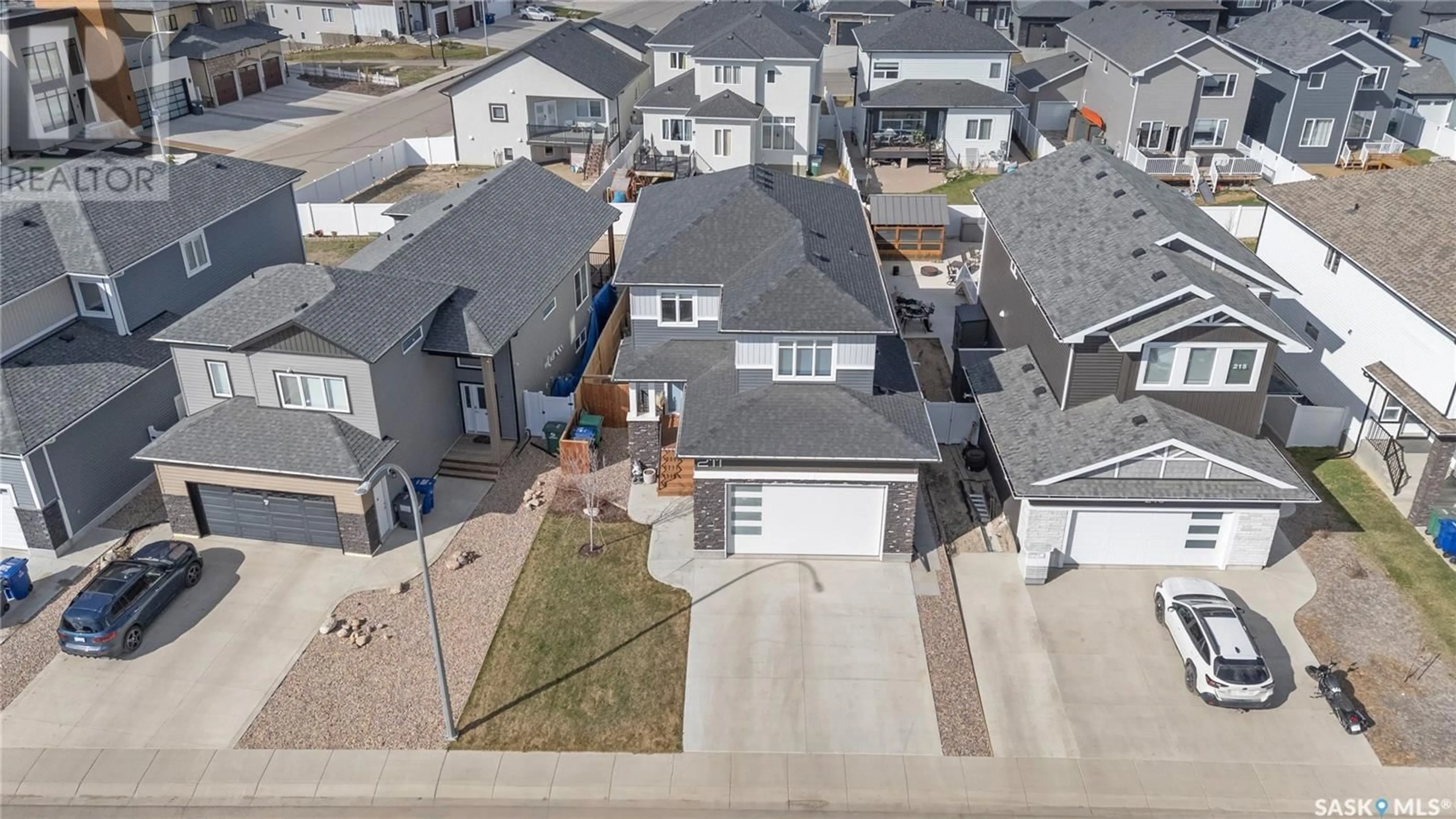 A pic from outside/outdoor area/front of a property/back of a property/a pic from drone, street for 211 KENASCHUK UNION, Saskatoon Saskatchewan S7W0Y3