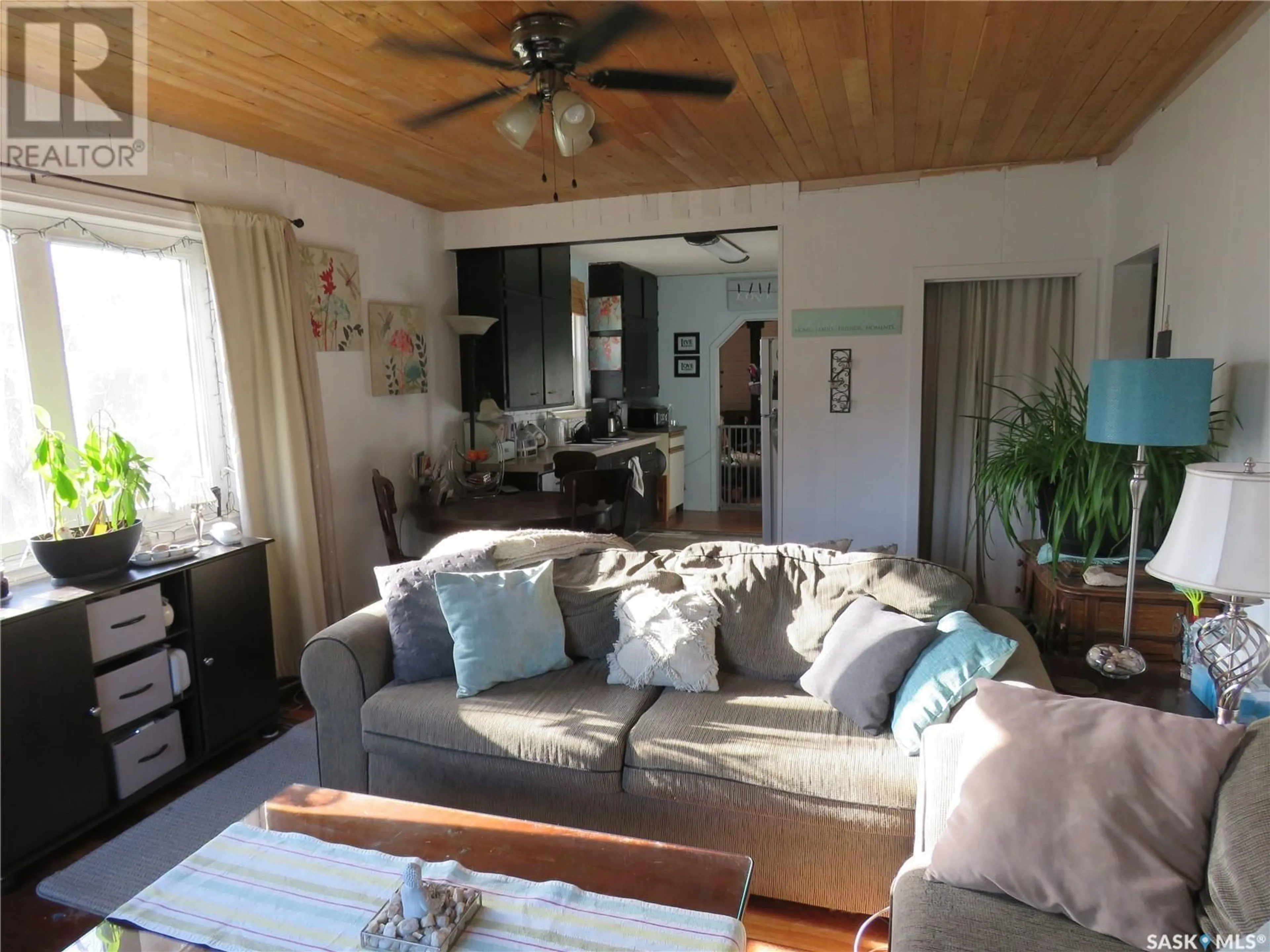 Living room with furniture, wood/laminate floor for 607 4TH AVENUE, Meadow Lake Saskatchewan S9X1A6