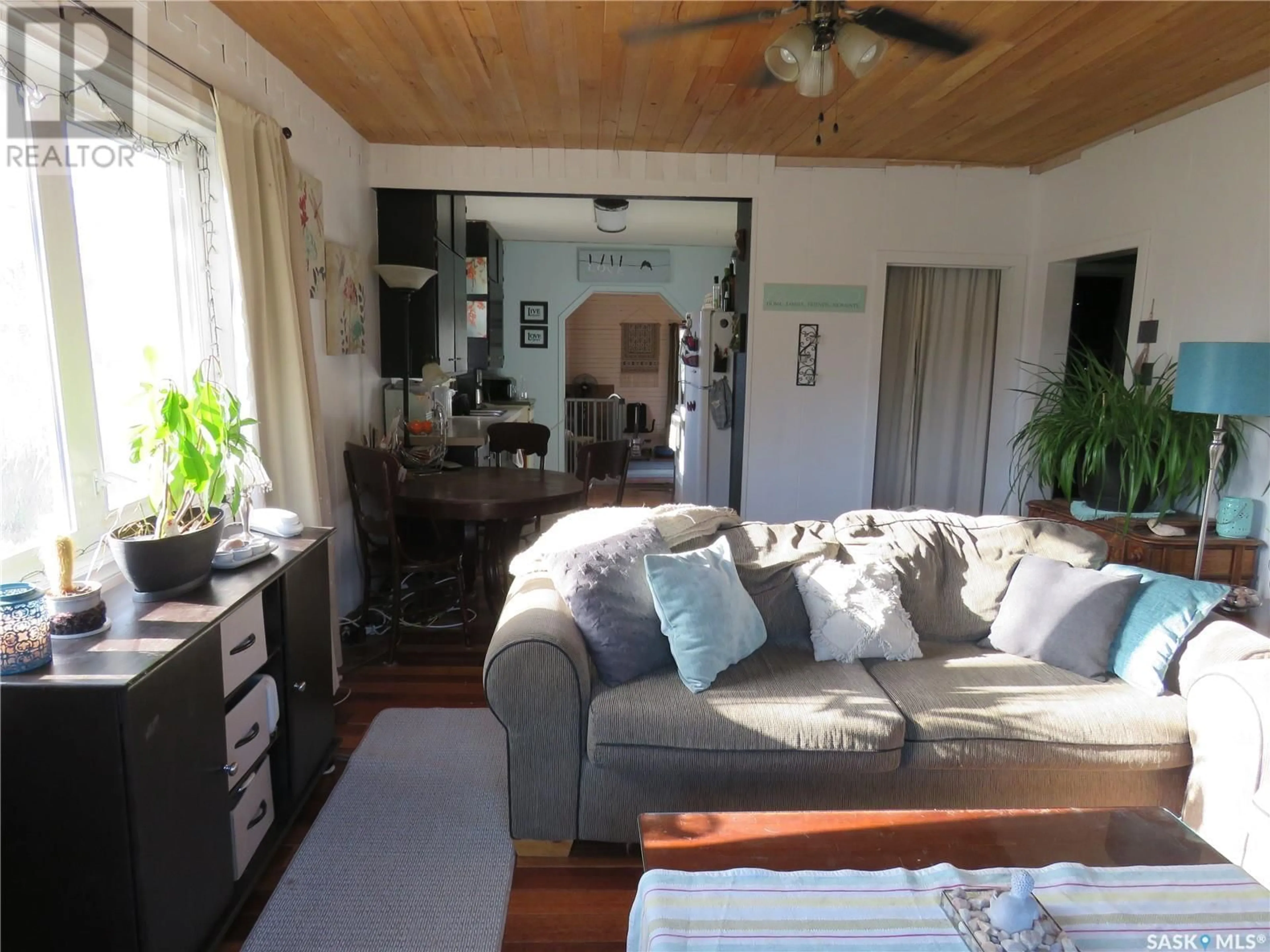 Living room with furniture, wood/laminate floor for 607 4TH AVENUE, Meadow Lake Saskatchewan S9X1A6