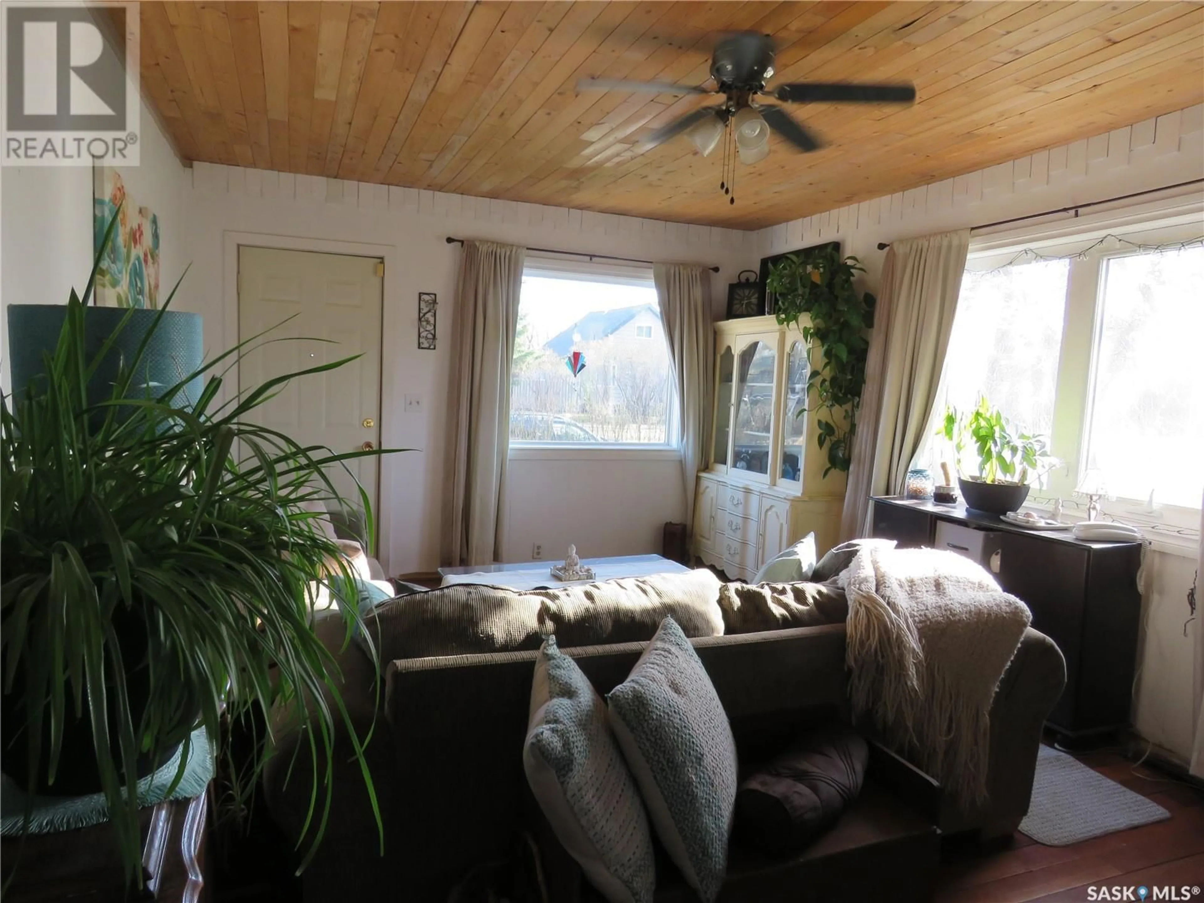 Living room with furniture, wood/laminate floor for 607 4TH AVENUE, Meadow Lake Saskatchewan S9X1A6