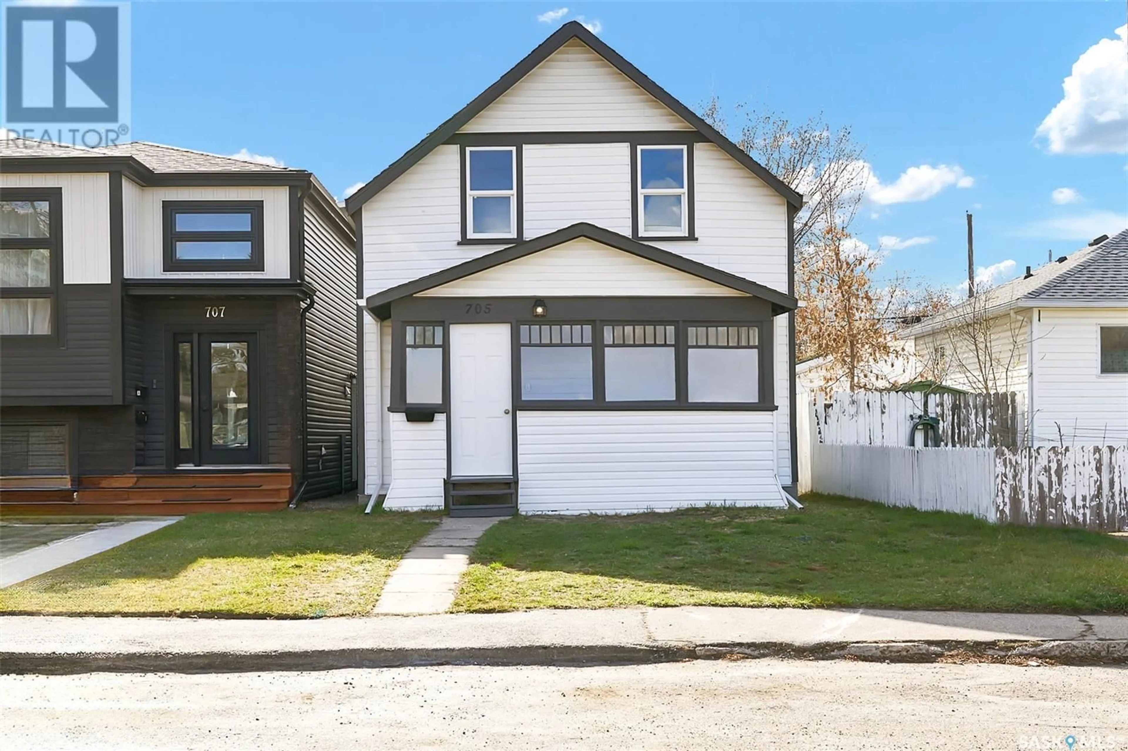 Home with vinyl exterior material, street for 705 L AVENUE, Saskatoon Saskatchewan S7M2H8
