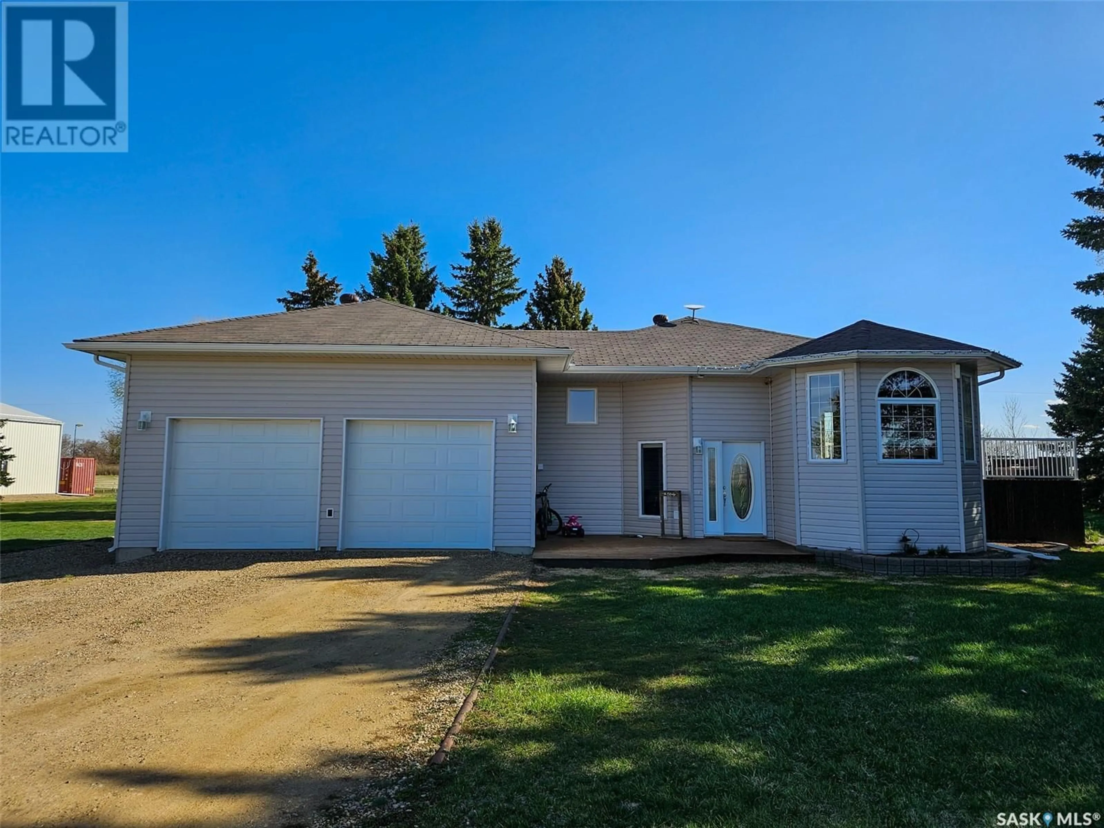 Home with vinyl exterior material, street for OSTROSKY ACREAGE, Carmichael Rm No. 109 Saskatchewan S0N2M0