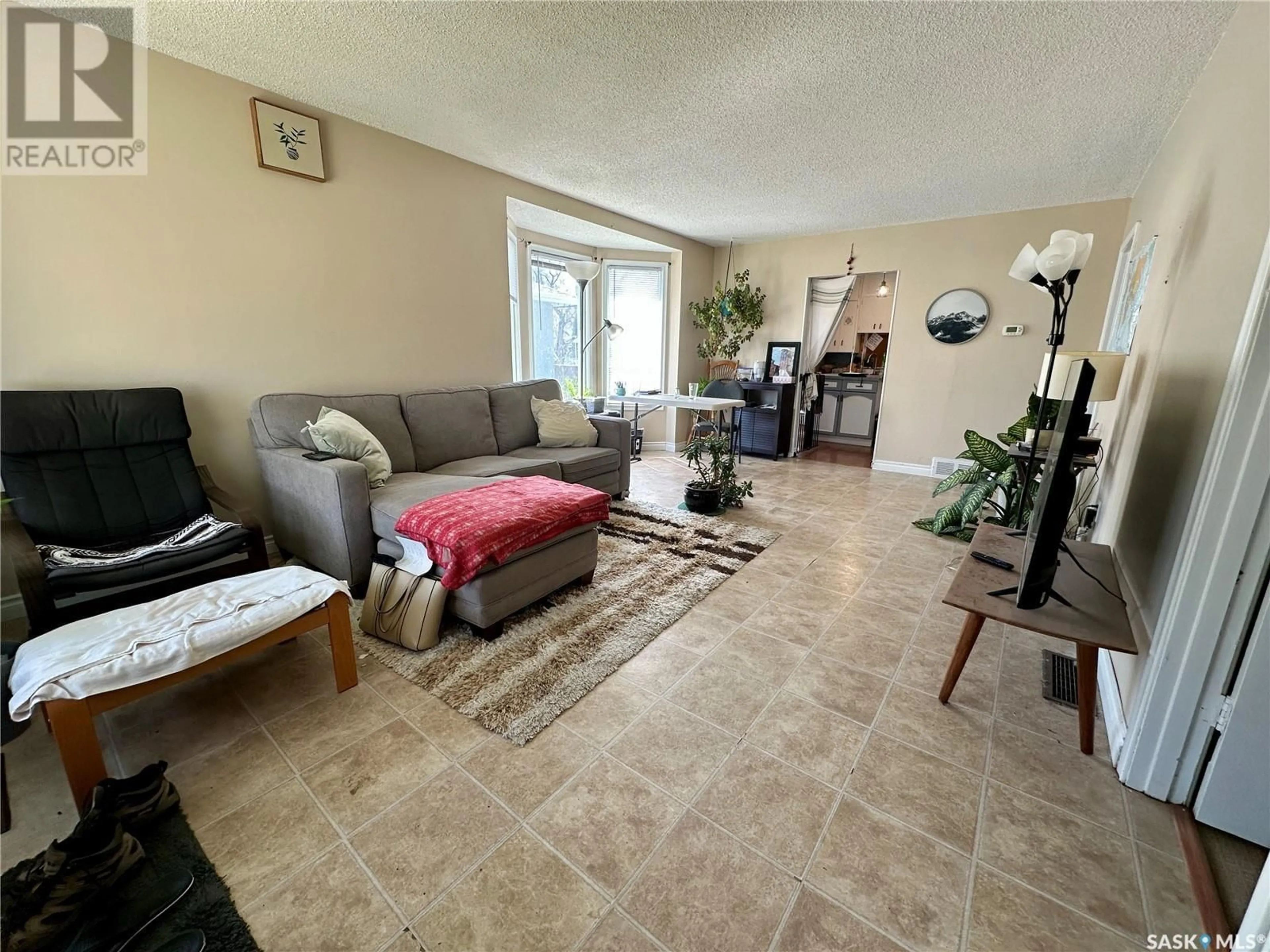 Living room with furniture, unknown for 1181 107TH STREET, North Battleford Saskatchewan S9A1Z2