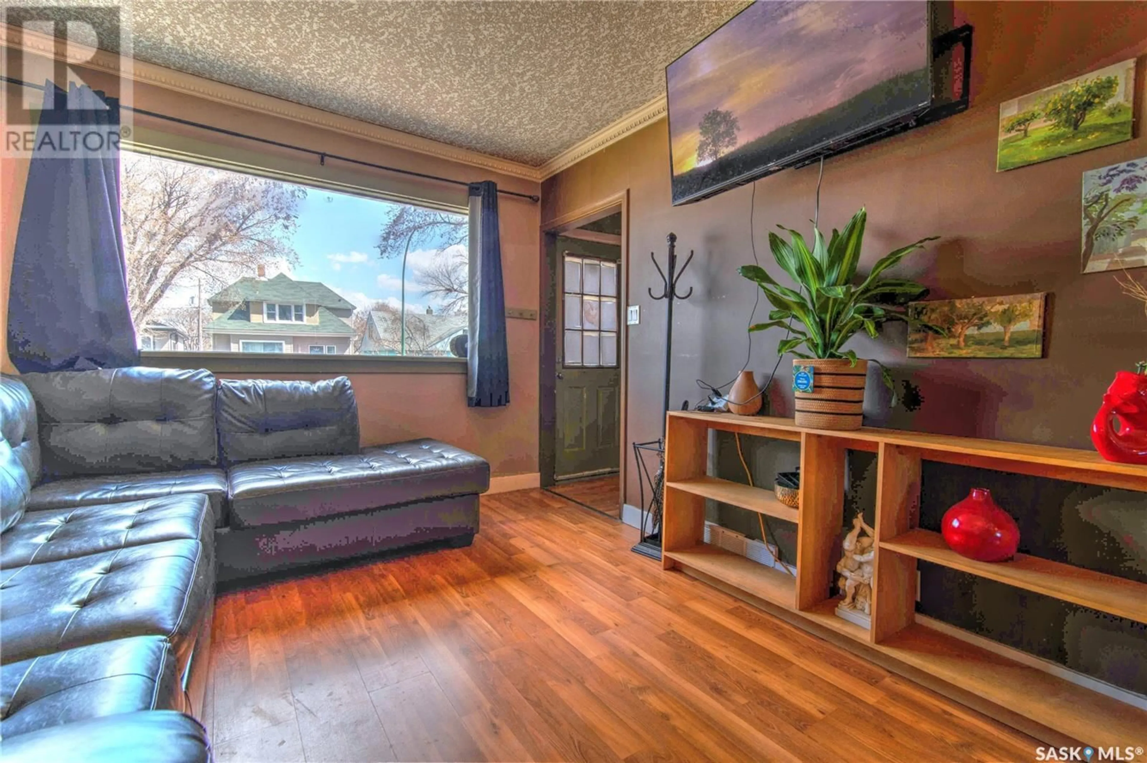 Living room with furniture, wood/laminate floor for 952 WALLACE STREET, Regina Saskatchewan S4N3Y5