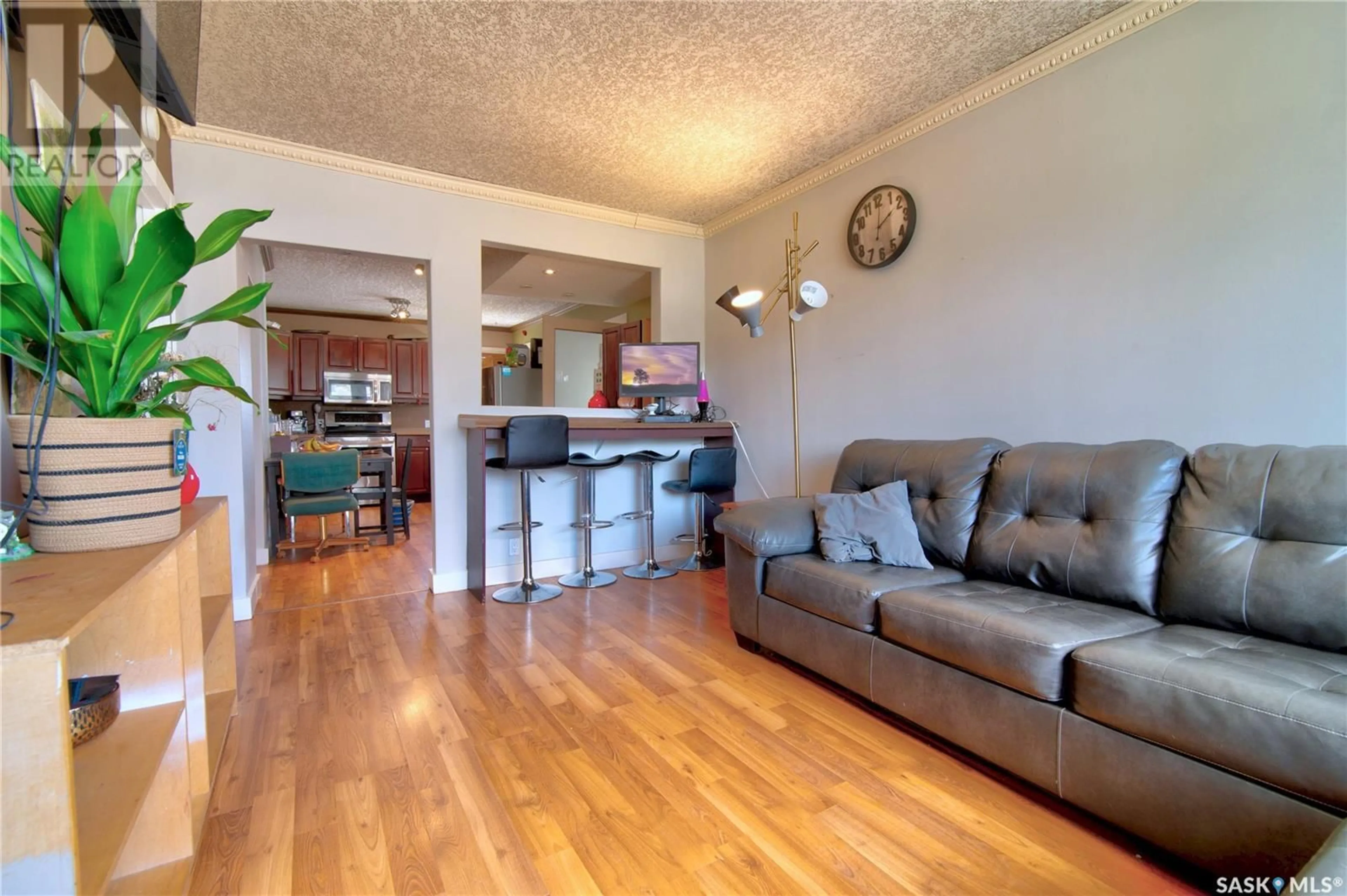 Living room with furniture, wood/laminate floor for 952 WALLACE STREET, Regina Saskatchewan S4N3Y5