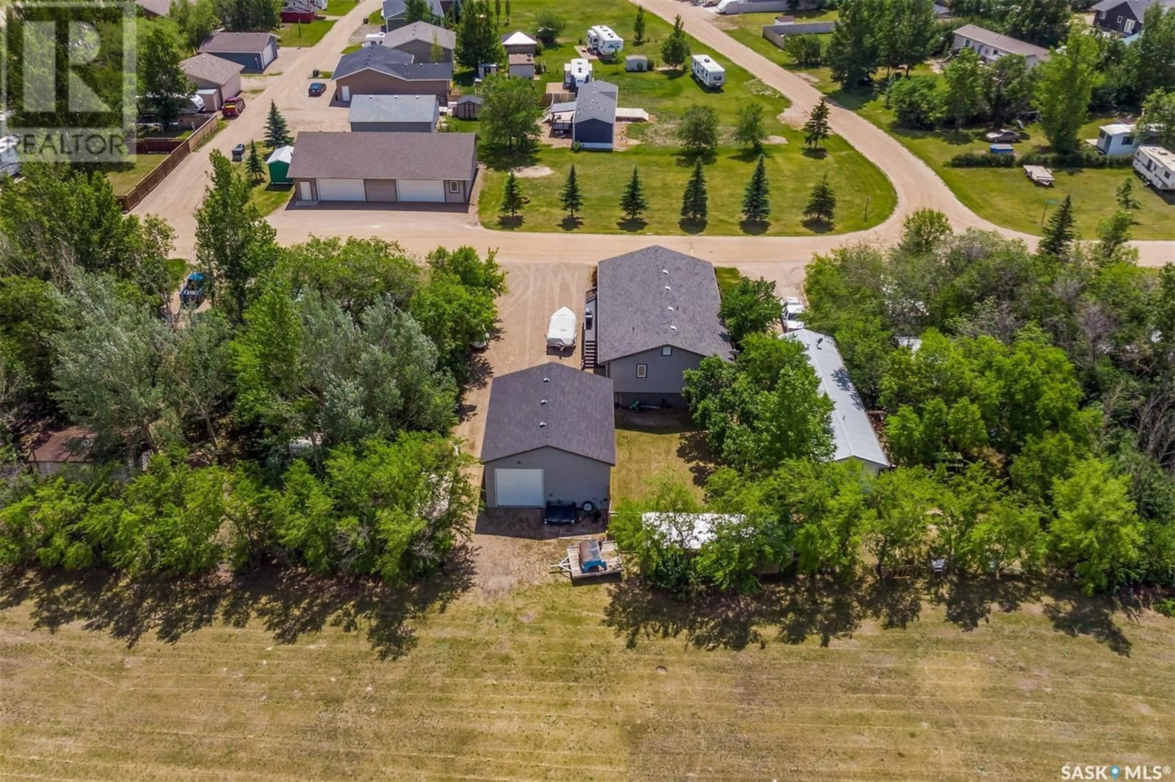 A pic from outside/outdoor area/front of a property/back of a property/a pic from drone, unknown for 24 KINGBIRD DRIVE, Glen Harbour Saskatchewan S0G4C0