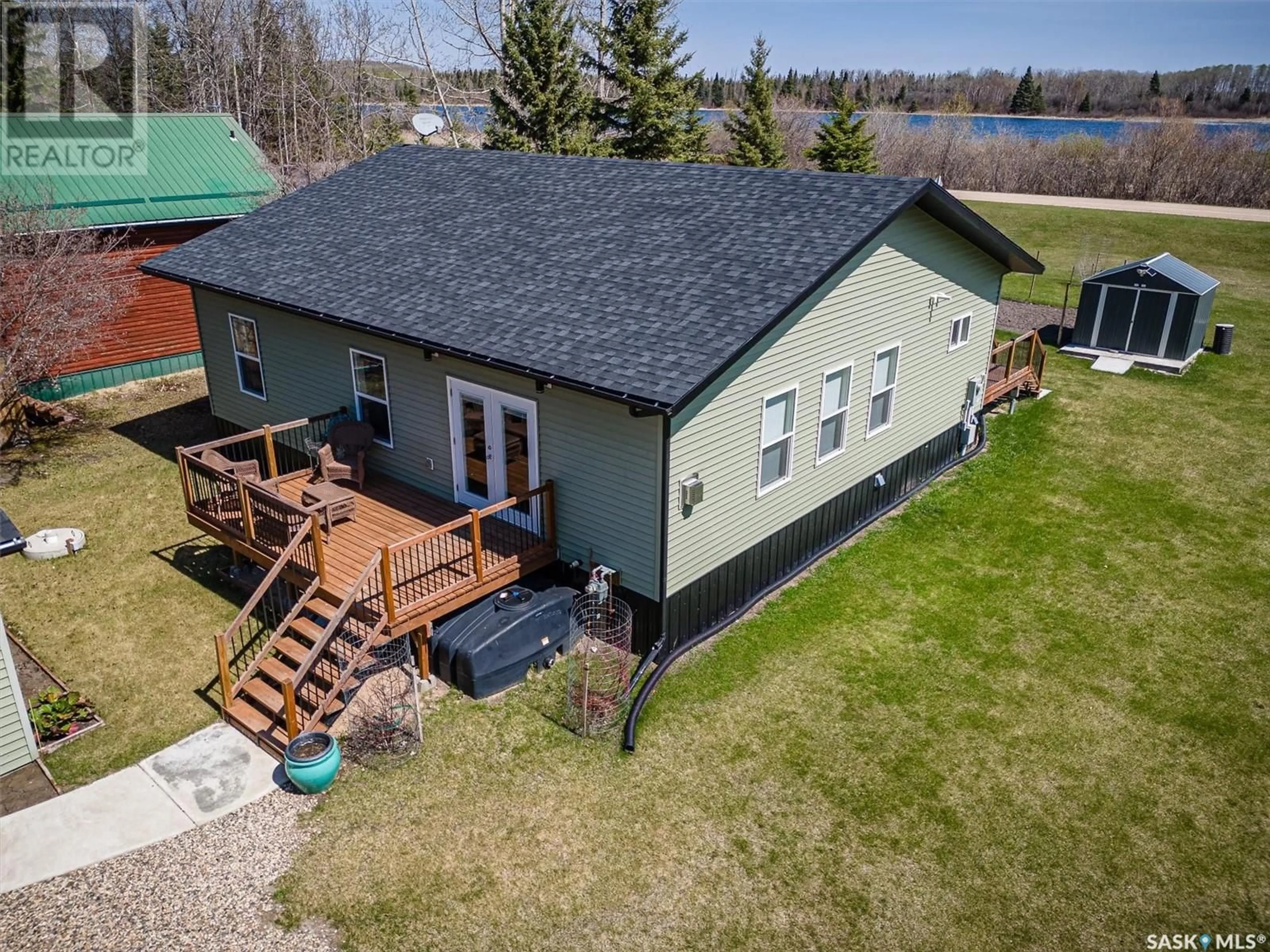A pic from outside/outdoor area/front of a property/back of a property/a pic from drone, water/lake/river/ocean view for 335 VENTURE ROAD, Pebble Baye Saskatchewan S0J2G0