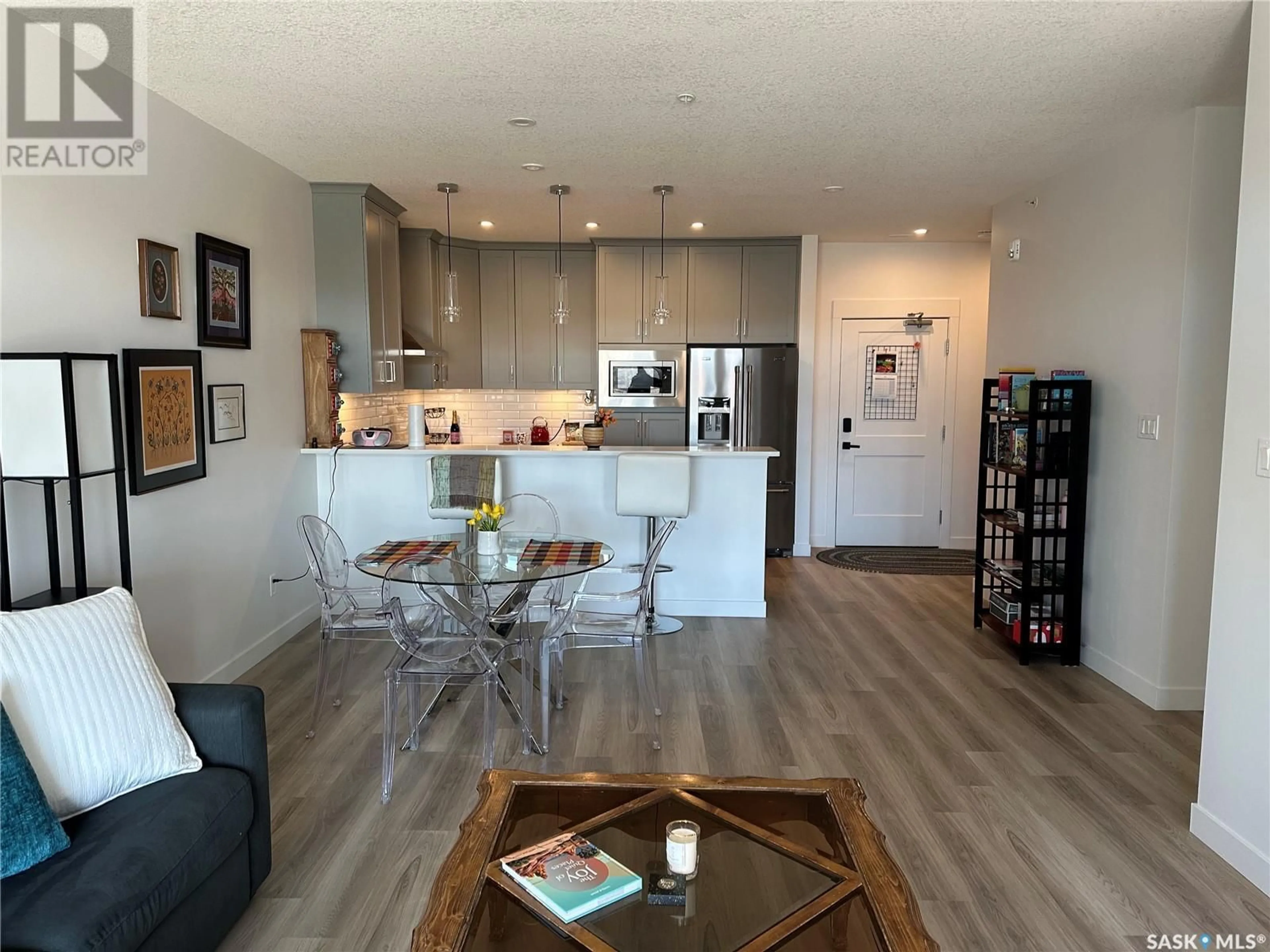 Open concept kitchen, wood/laminate floor for 204 - 3581 EVANS COURT, Regina Saskatchewan S4S7A3