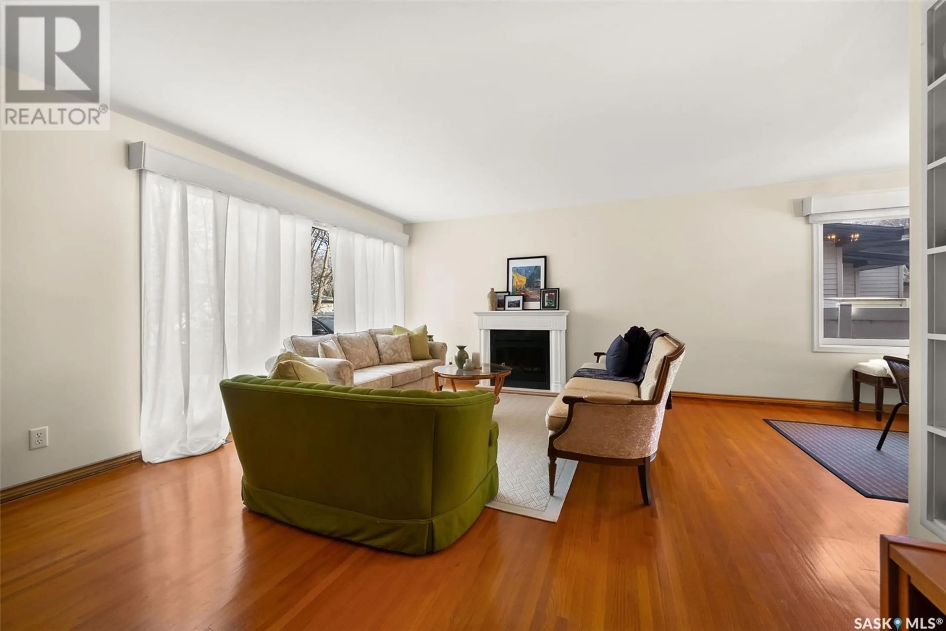 Living room with furniture, wood/laminate floor for 2515 CROSS PLACE, Regina Saskatchewan S4S4C8