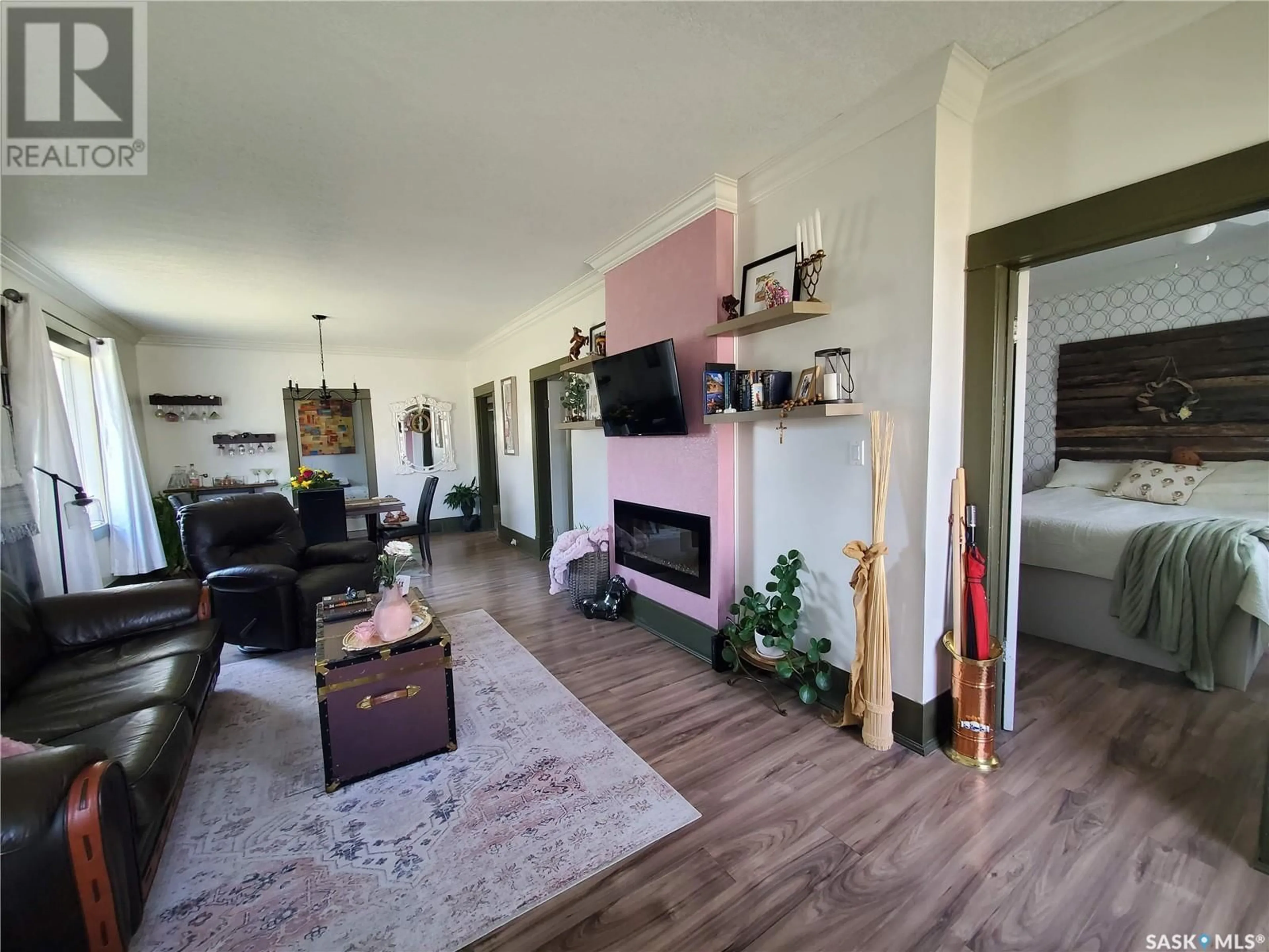 Living room with furniture, wood/laminate floor for 302 THIRD STREET, Kamsack Saskatchewan S0A1S0