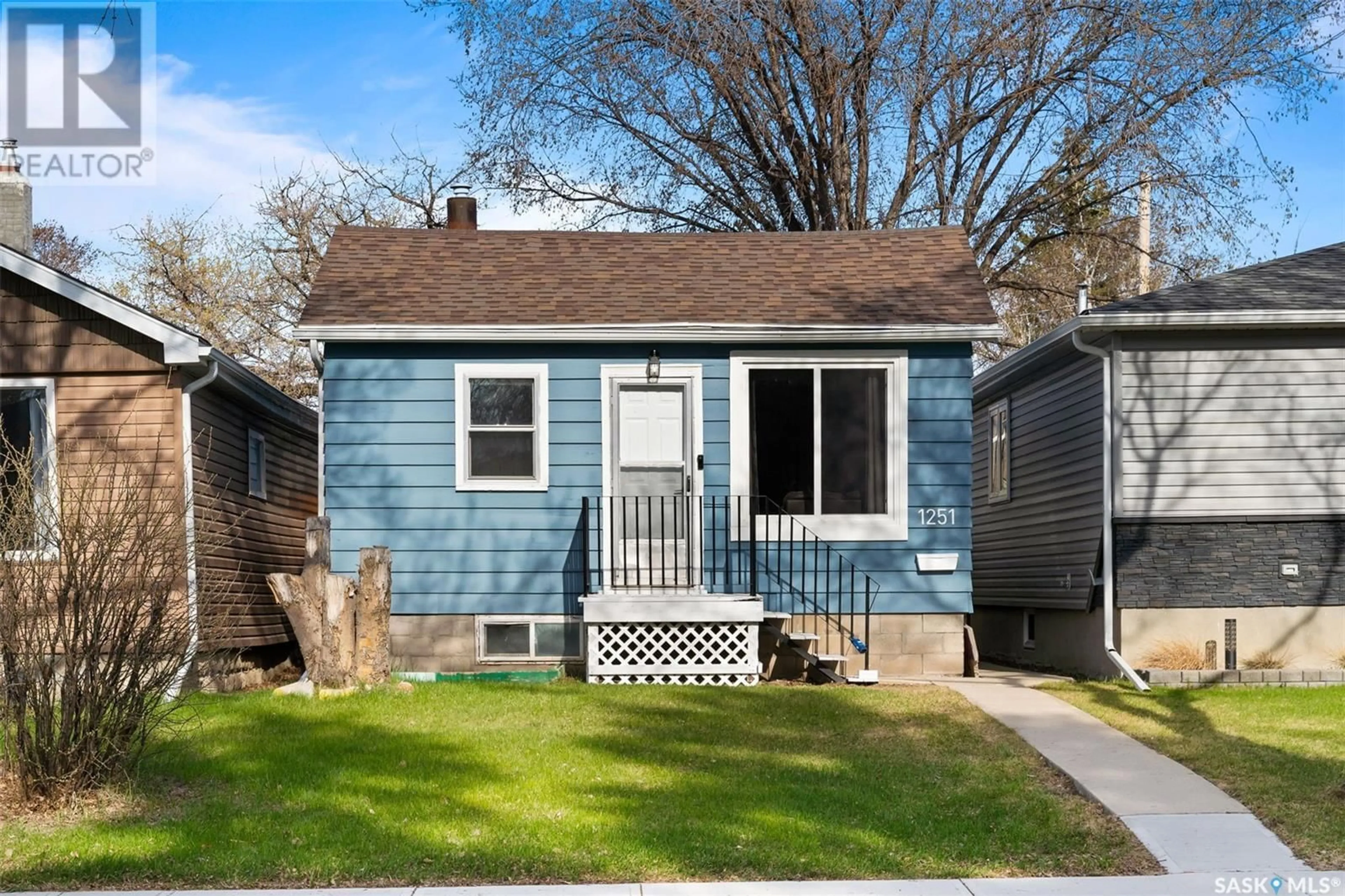 Home with vinyl exterior material, street for 1251 ROYAL STREET, Regina Saskatchewan S4T4Z9