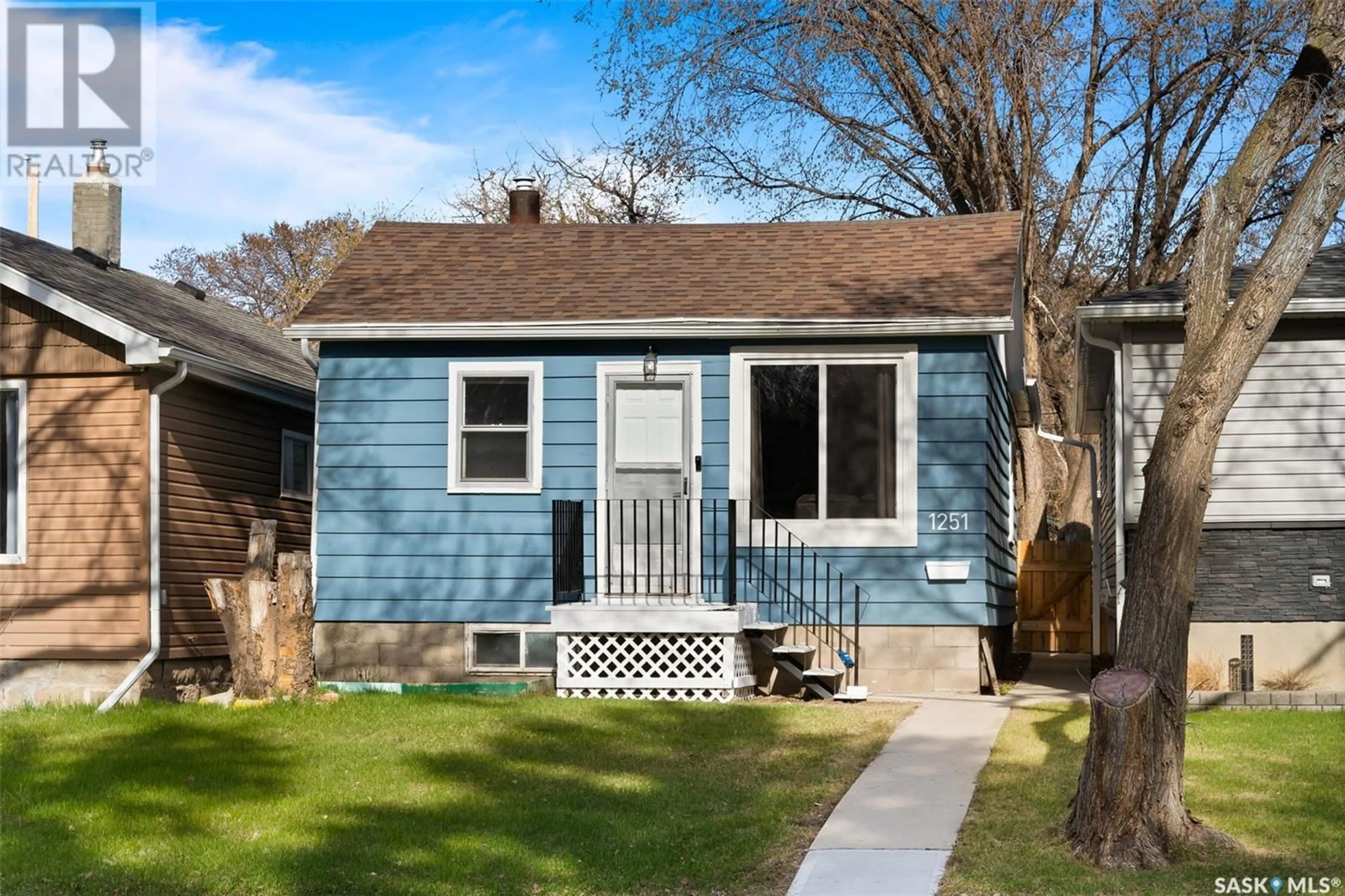 Home with vinyl exterior material, street for 1251 ROYAL STREET, Regina Saskatchewan S4T4Z9