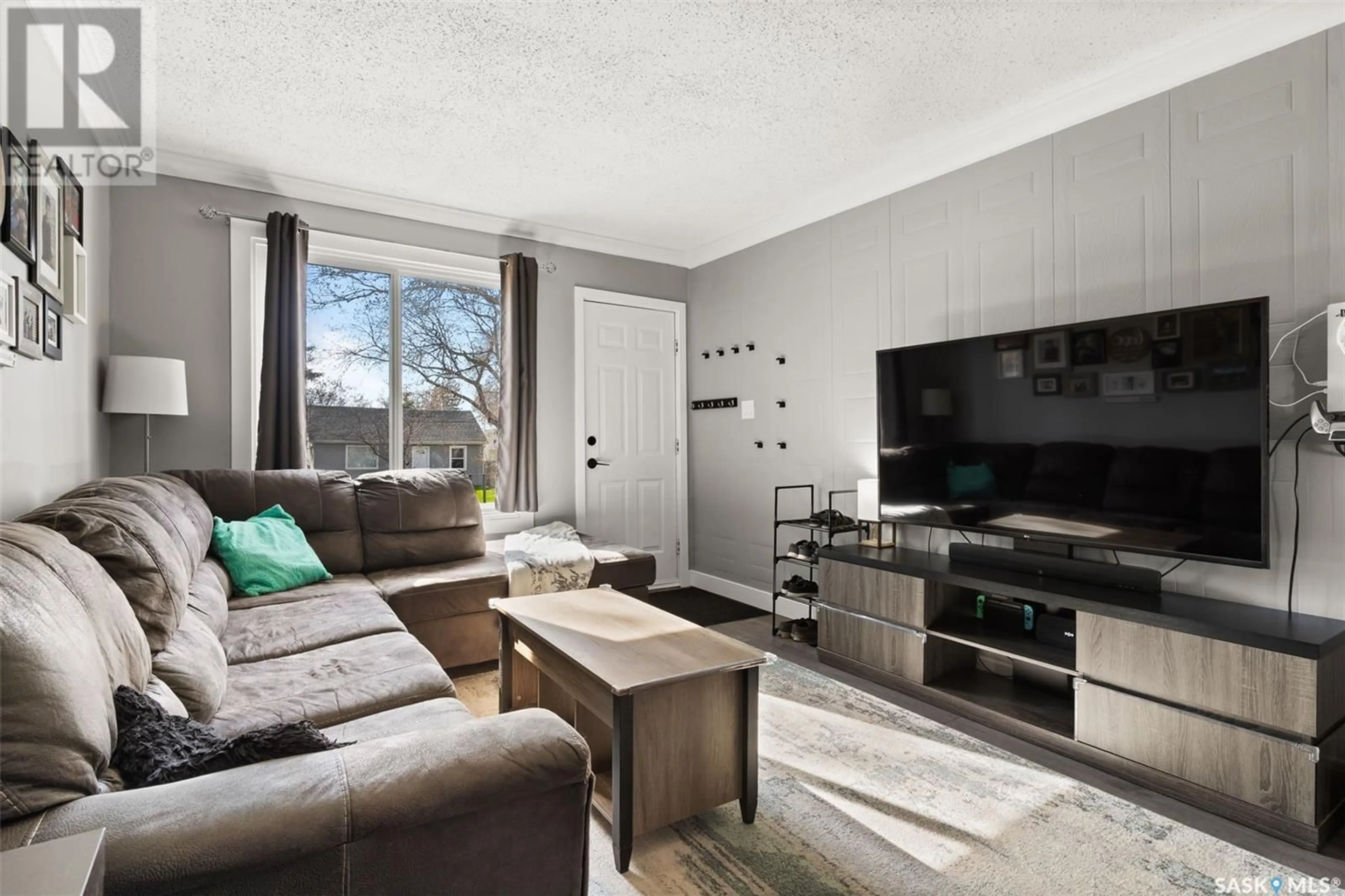 Living room with furniture, wood/laminate floor for 1251 ROYAL STREET, Regina Saskatchewan S4T4Z9