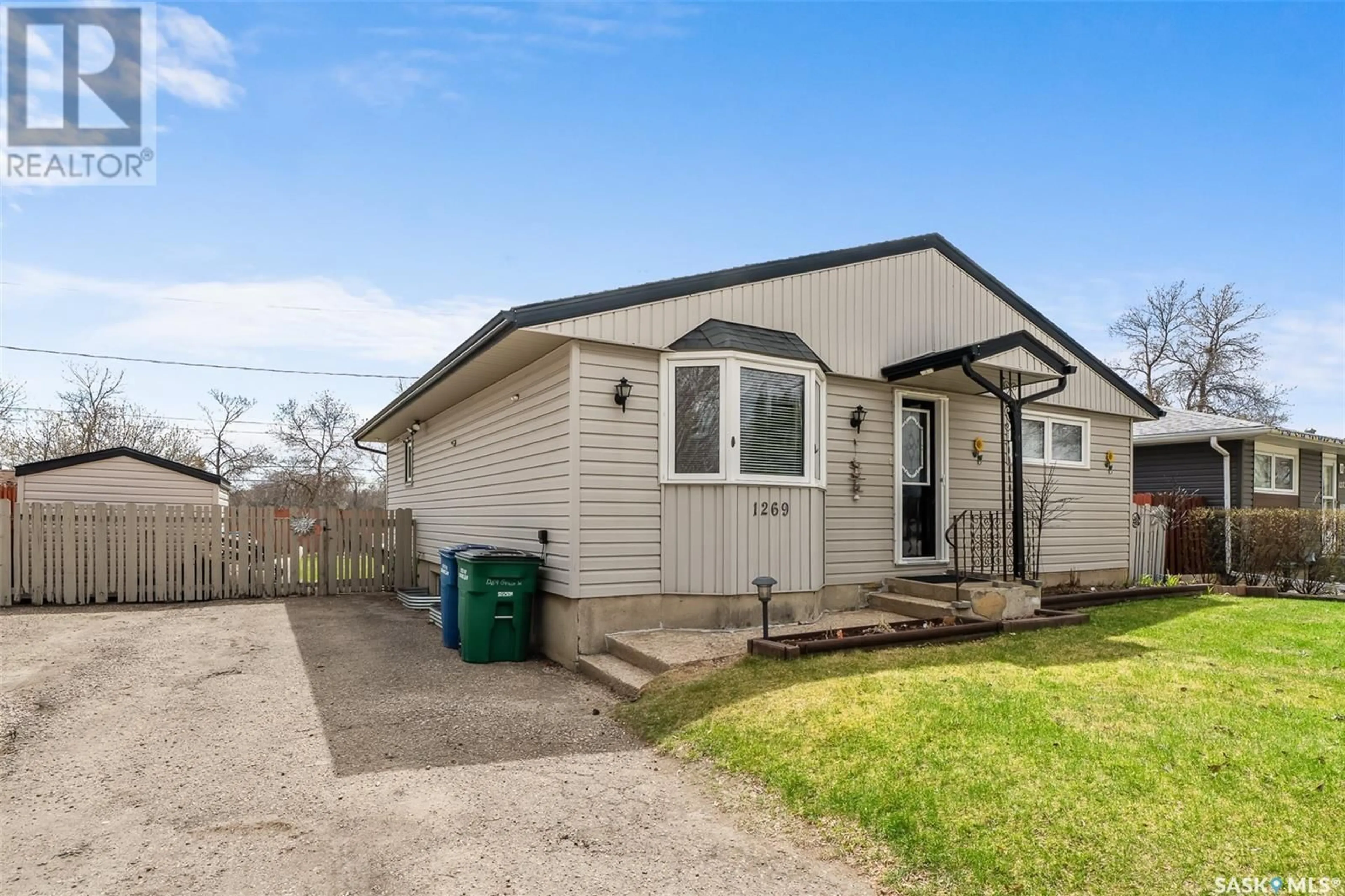 Home with vinyl exterior material, street for 1269 GRACE STREET, Moose Jaw Saskatchewan S6H3C6