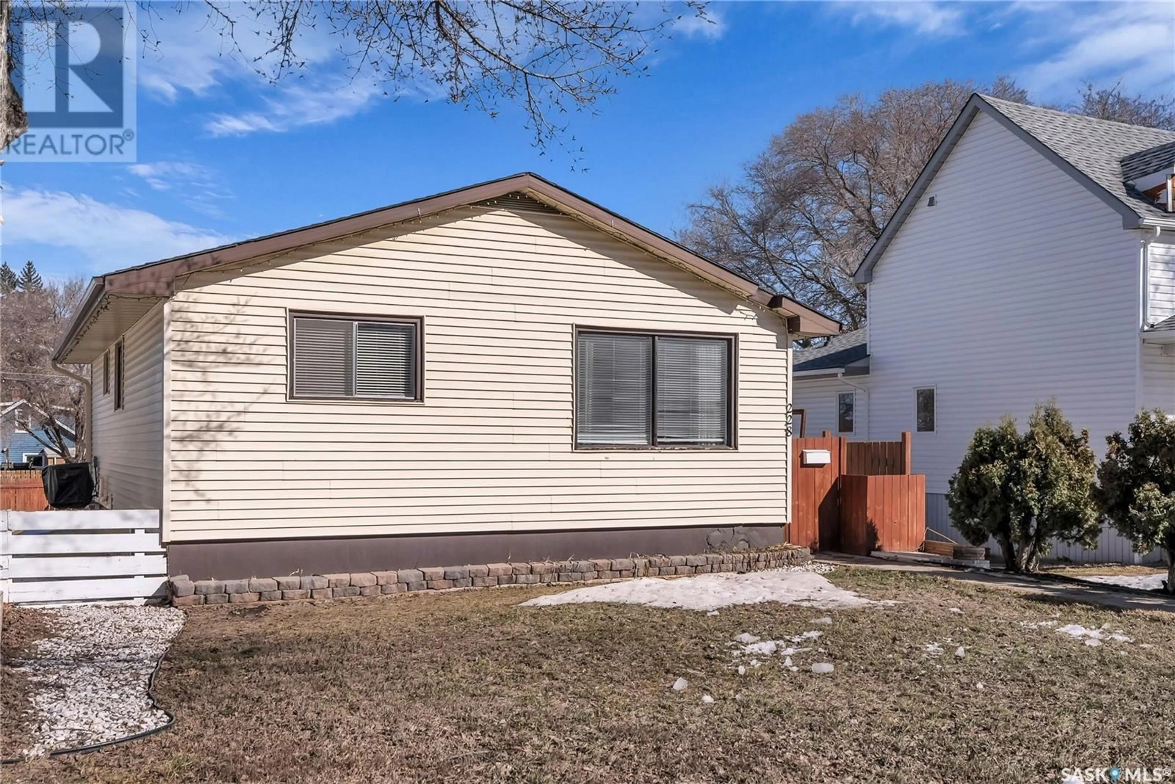 Home with vinyl exterior material, street for 228 Y AVENUE, Saskatoon Saskatchewan S7M3J5