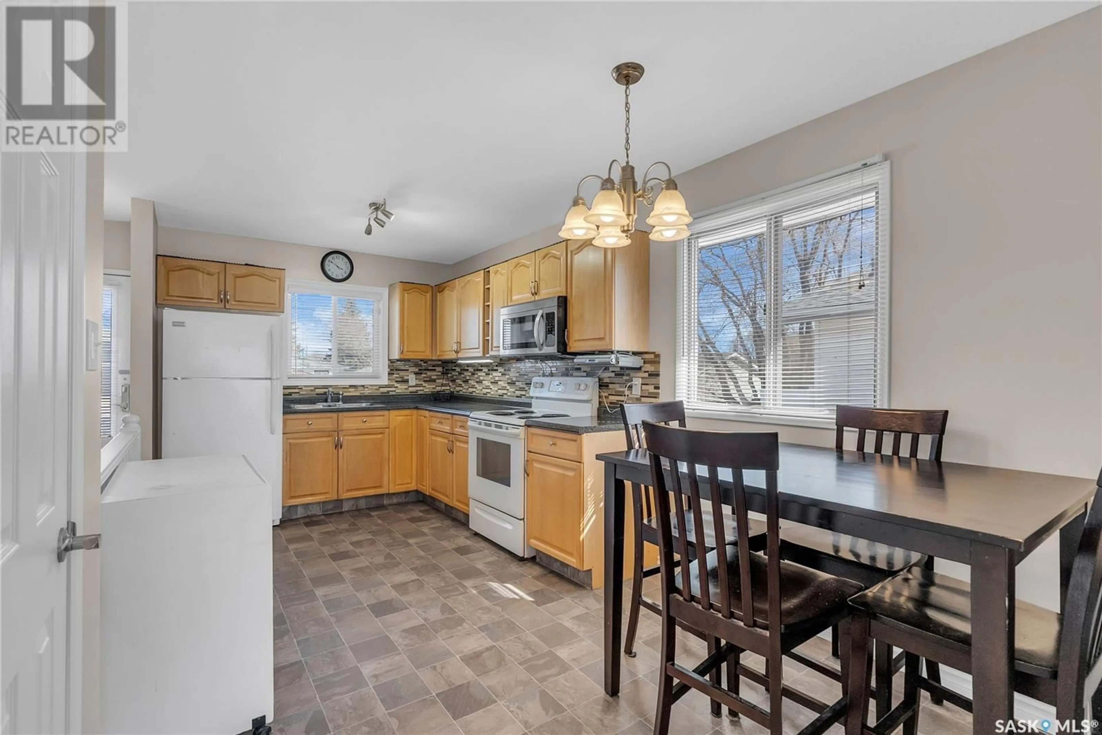 Open concept kitchen, ceramic/tile floor for 228 Y AVENUE, Saskatoon Saskatchewan S7M3J5
