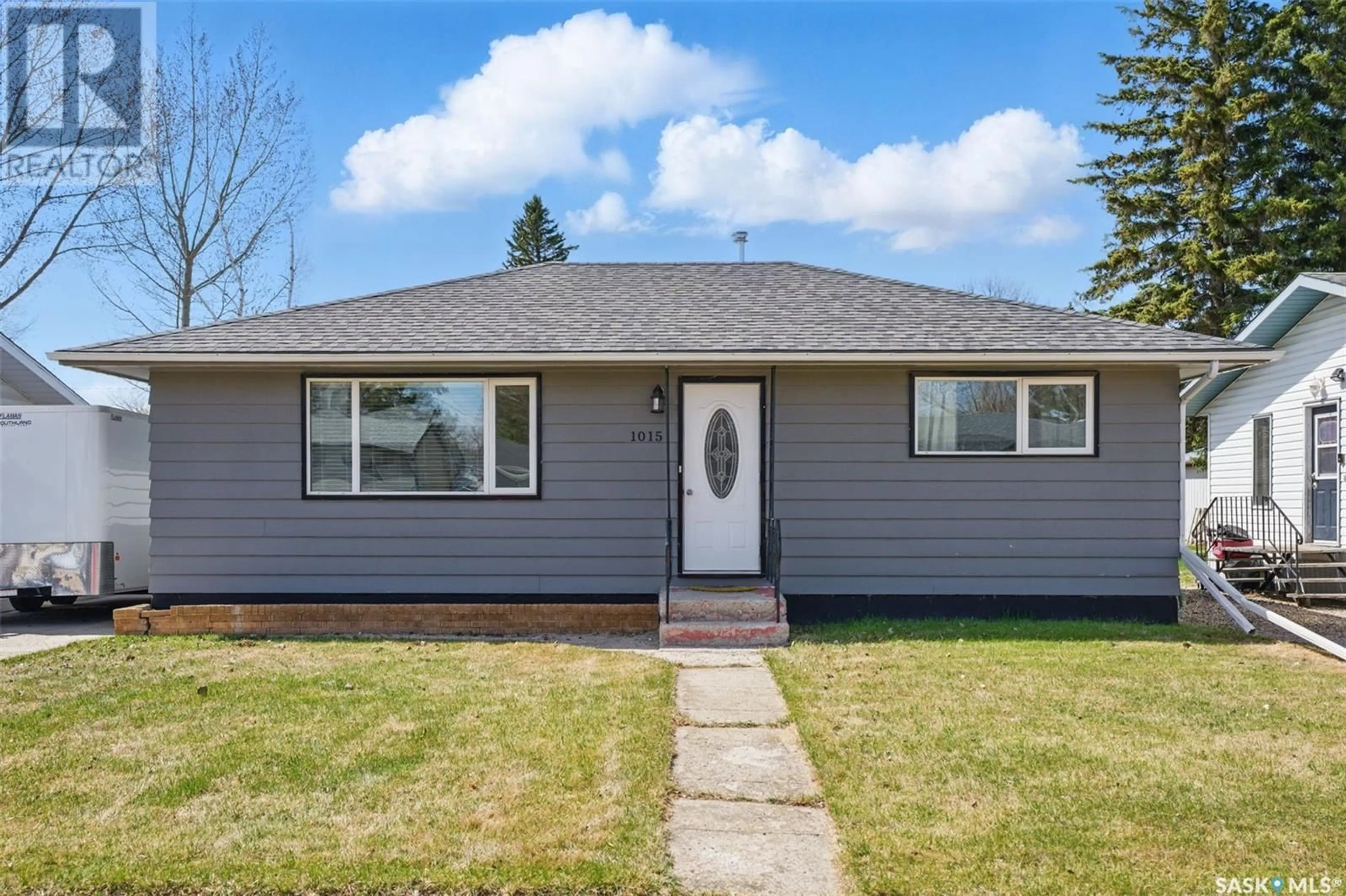 Home with vinyl exterior material, street for 1015 11TH STREET, Humboldt Saskatchewan S0K2A0