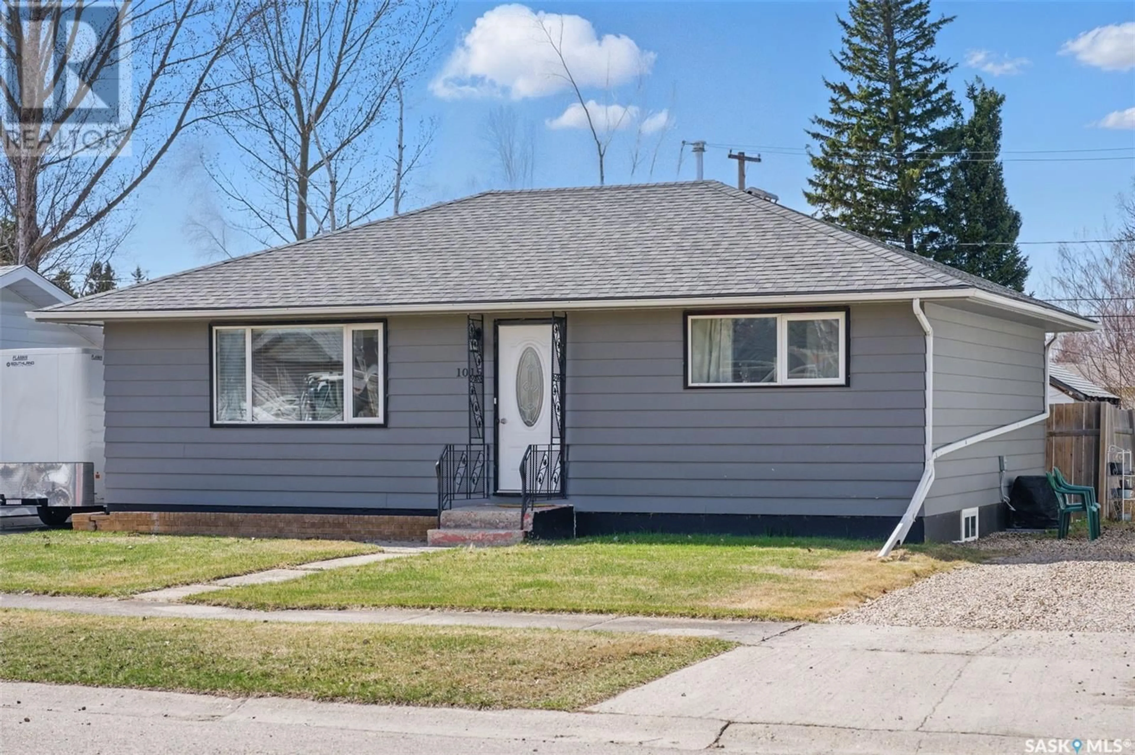 Home with vinyl exterior material, street for 1015 11TH STREET, Humboldt Saskatchewan S0K2A0