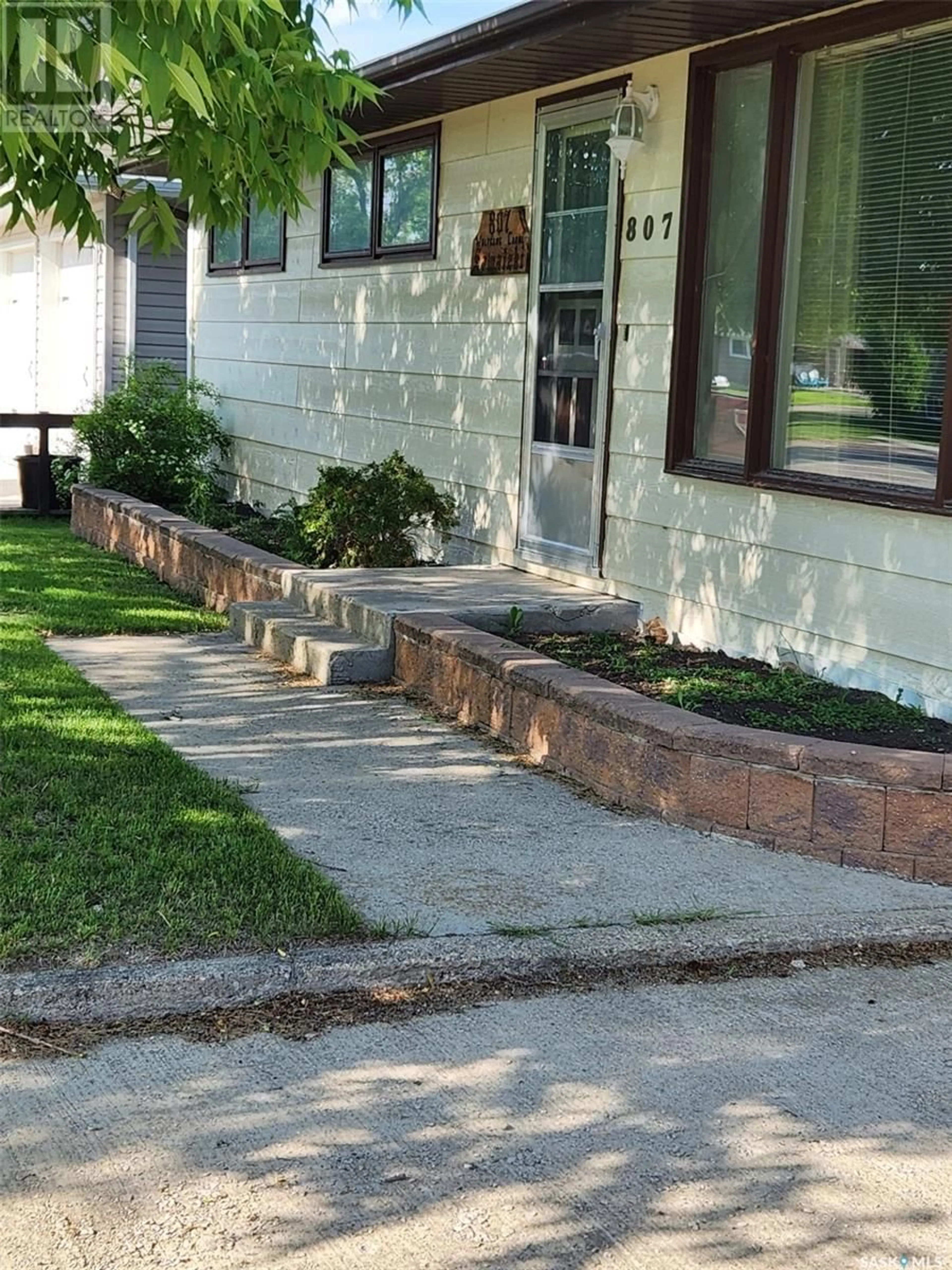 Home with brick exterior material, street for 807 ELSINORE STREET, Whitewood Saskatchewan S0G5C0